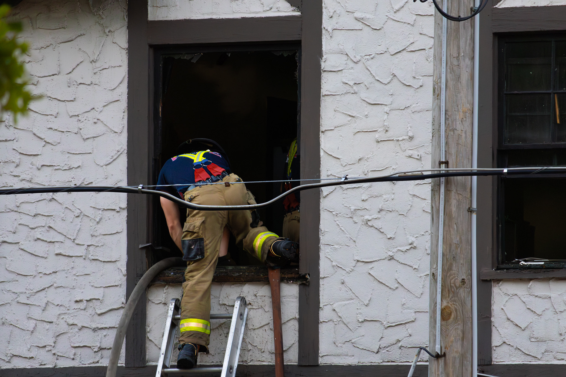 Louisville Firefighter Entering Building on The Corner of 2nd and Oak Street. June 7th, 2024/Aspen Hester