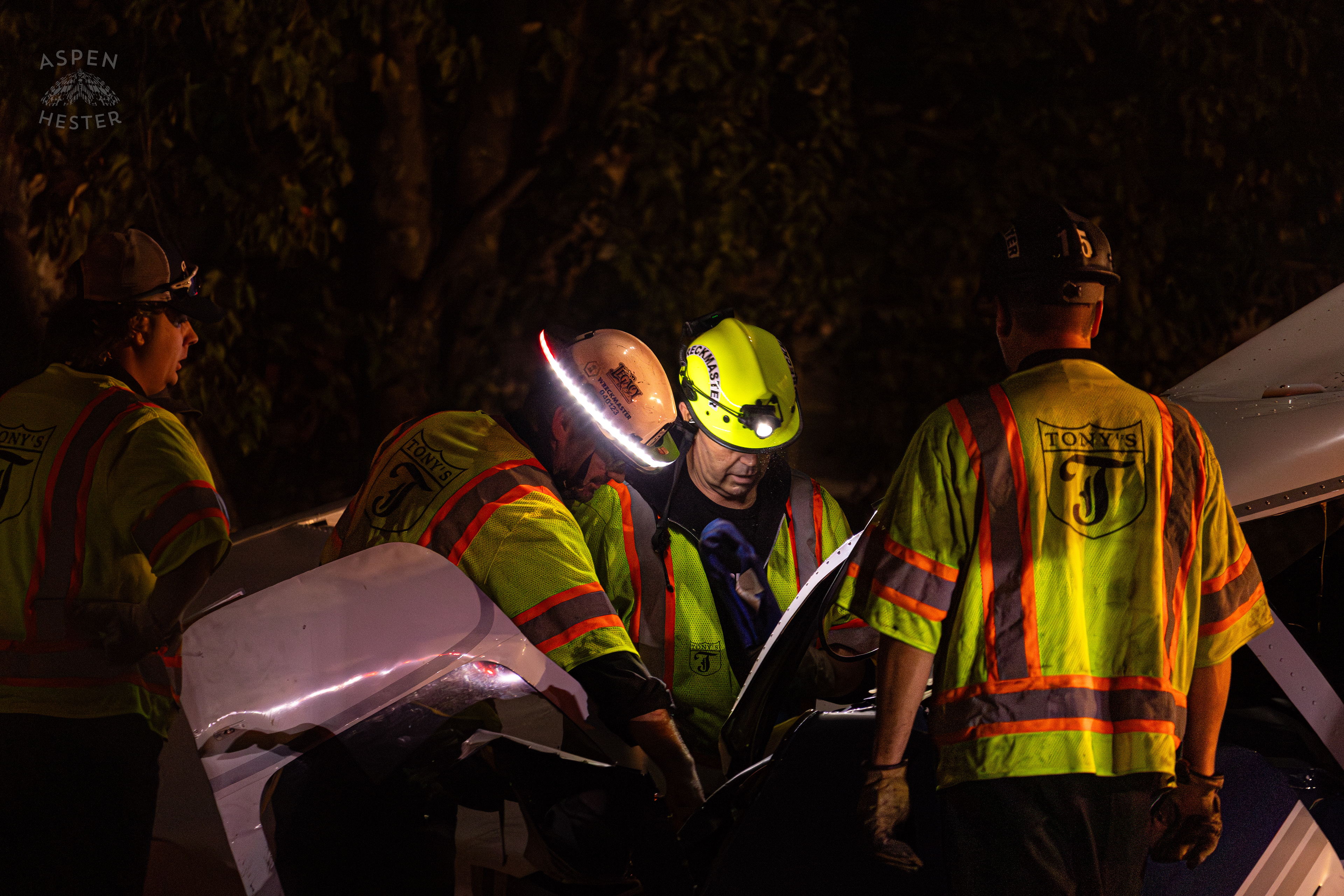 Tony’s Wreckers Crew Working to Remove The Piper Cherokee Plane from the Road after it Crash Landed, Taking Out Utility Poles, and Hitting A Car on Breckenridge Lane and Kresge Way. October 11th, 2024/Aspen Hester 