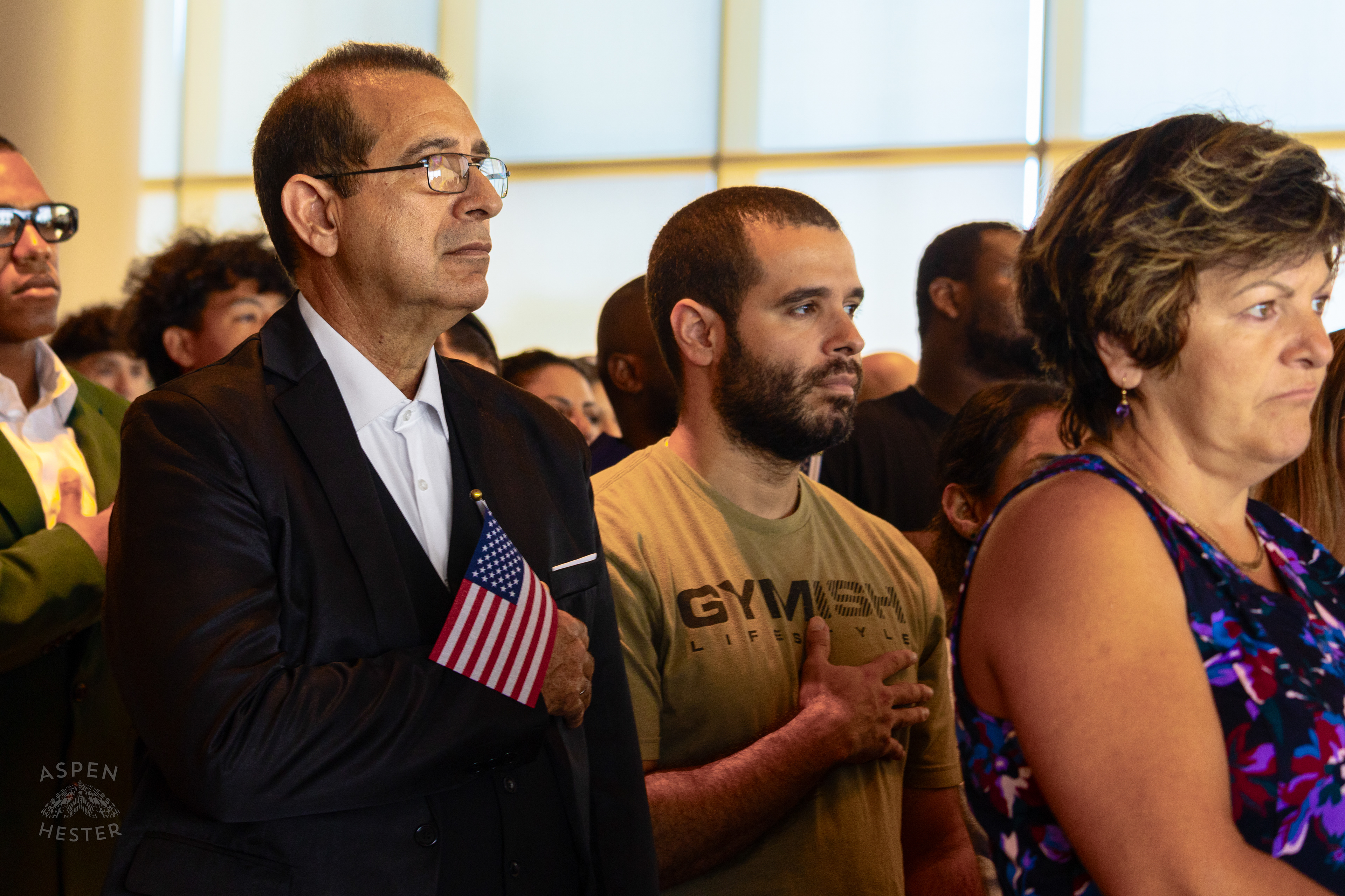 Soon to be American Citizens Standing for The Singing of The Star Spangled Banner During WorldFest's Naturalization Ceremony. August 30th, 2024/Aspen Hester