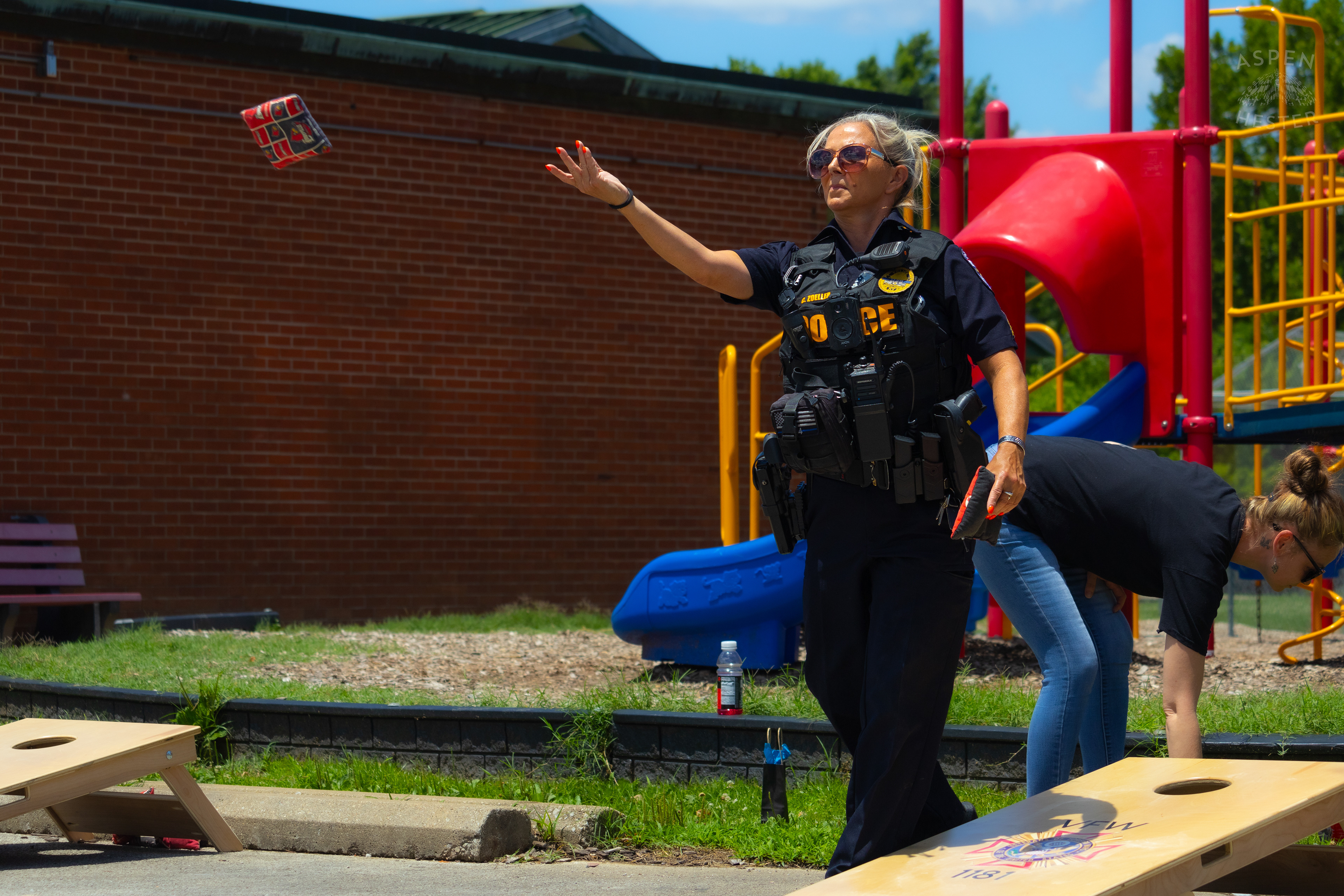 LMPD Officer Carmine Zoeller Participates in "Cornhole with Cops" Event. July 6th, 2024/Aspen Hester