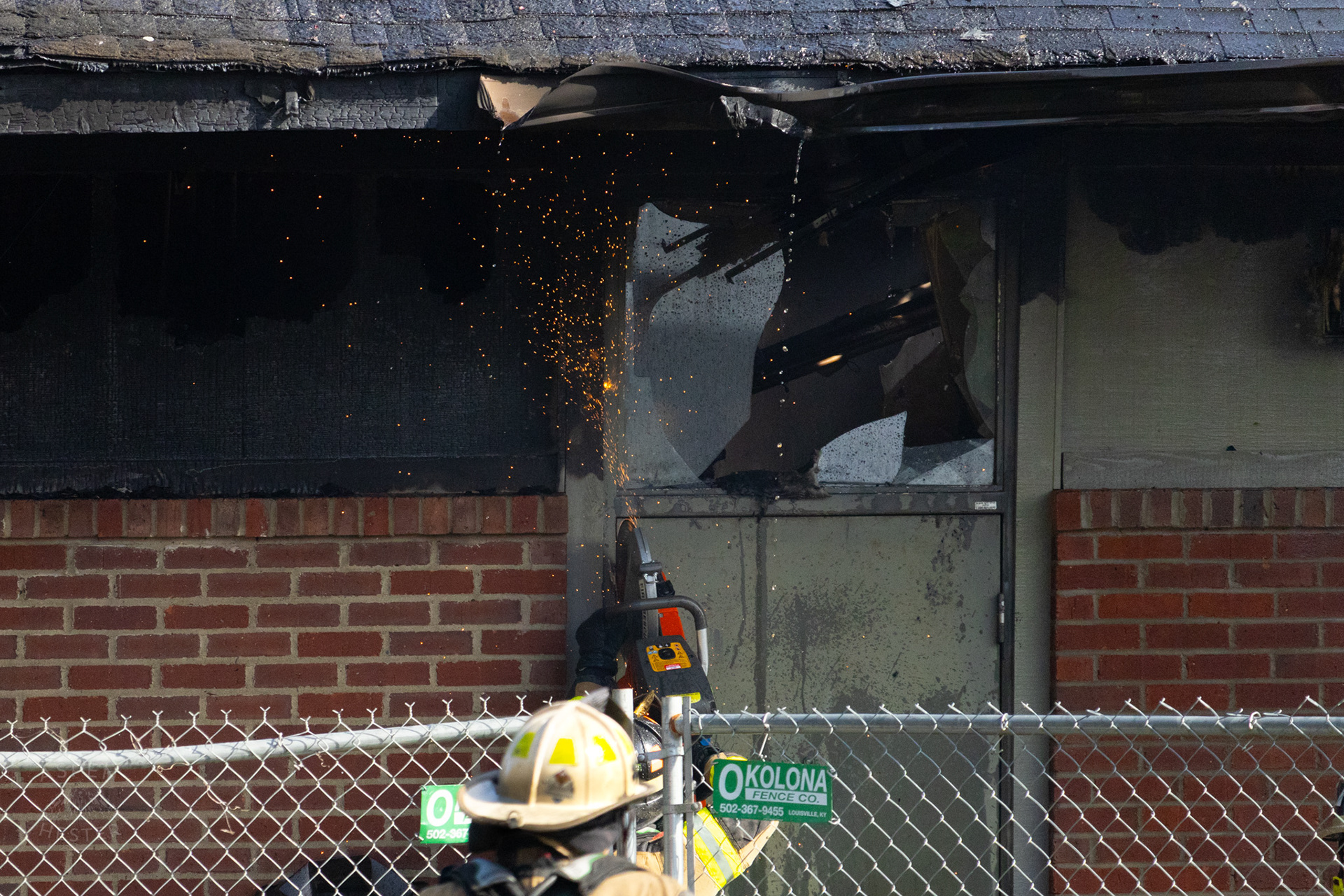 Firefighter Sawing into A Metal Door at The Old Library on Preston Highway. May 31st, 2024/Aspen Hester