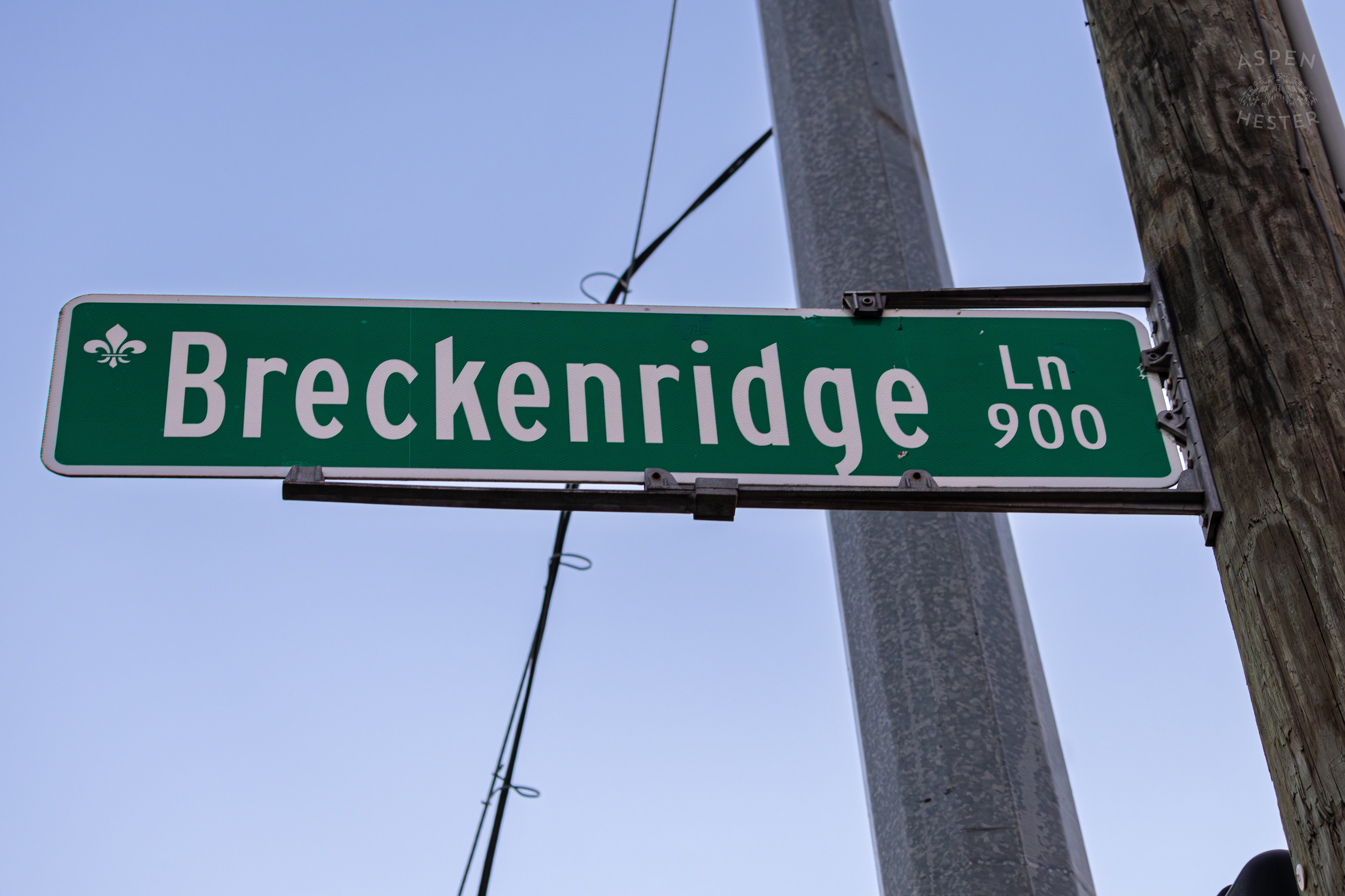 Street Sign for Breckenridge Lane Looms Over The Destruction Left after A Piper Cherokee Plane Crash Landed, Taking Out Utility Poles, and Hitting A Car on Breckenridge Lane and Kresge Way. October 11th, 2024/Aspen Hester 