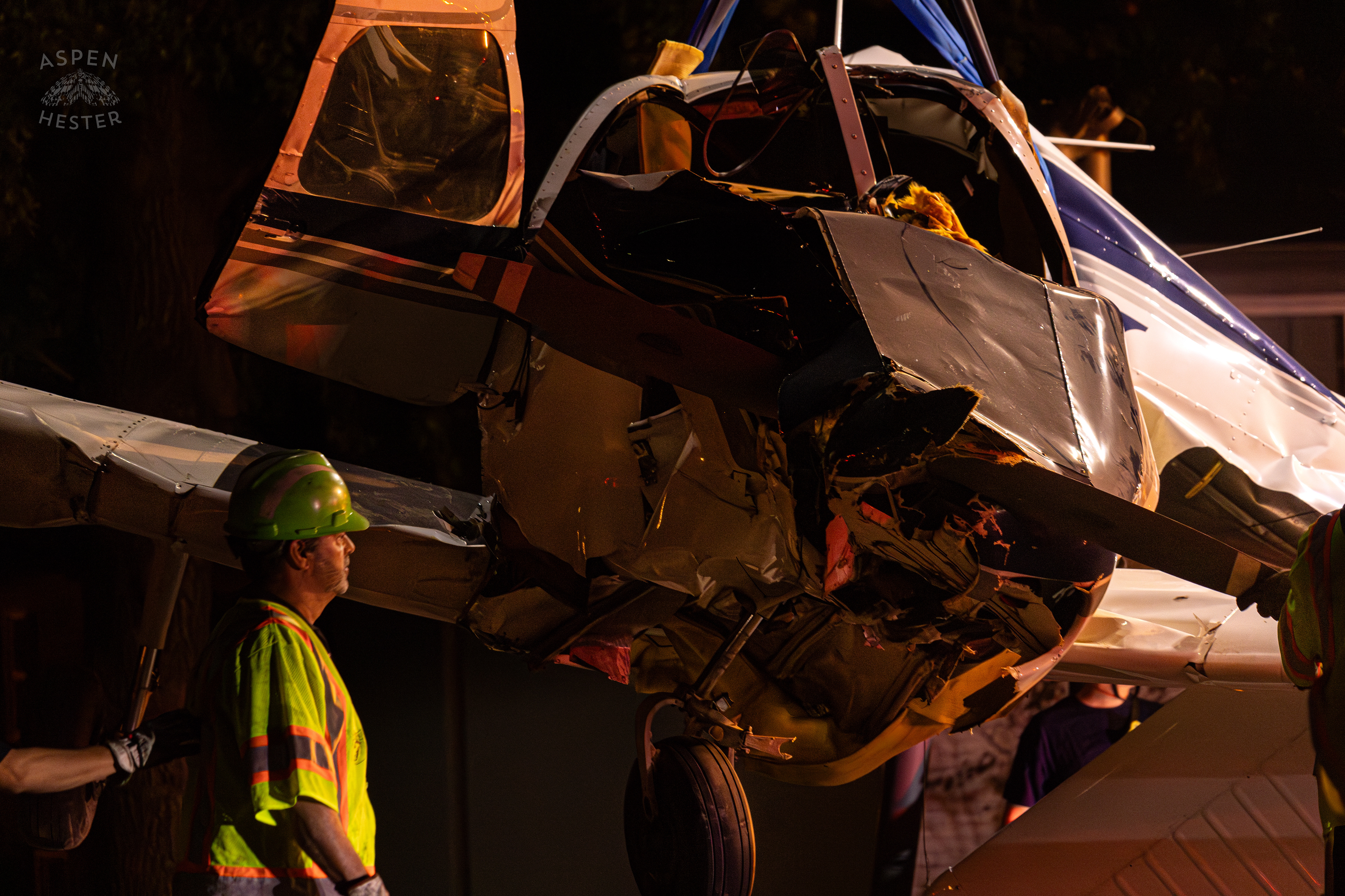 Tony’s Wreckers Crew Working to Remove The Piper Cherokee Plane from the Road after it Crash Landed, Taking Out Utility Poles, and Hitting A Car on Breckenridge Lane and Kresge Way. October 11th, 2024/Aspen Hester 