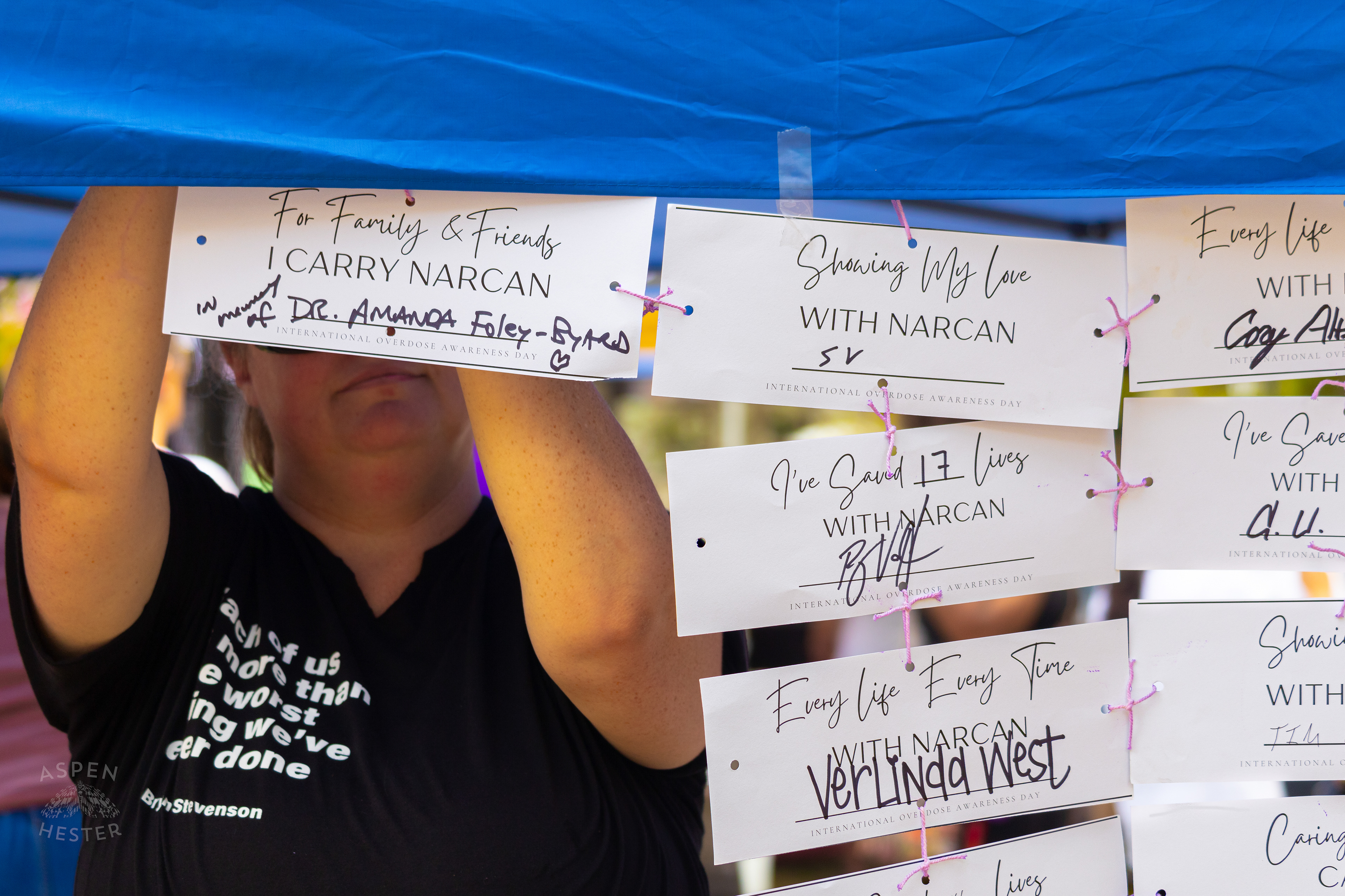 Cards Sharing Why People Carry Narcan with Them at The 3rd Annual Vocal KY International Overdose Awareness Day Rally and March. August 31st, 2024/Aspen Hester