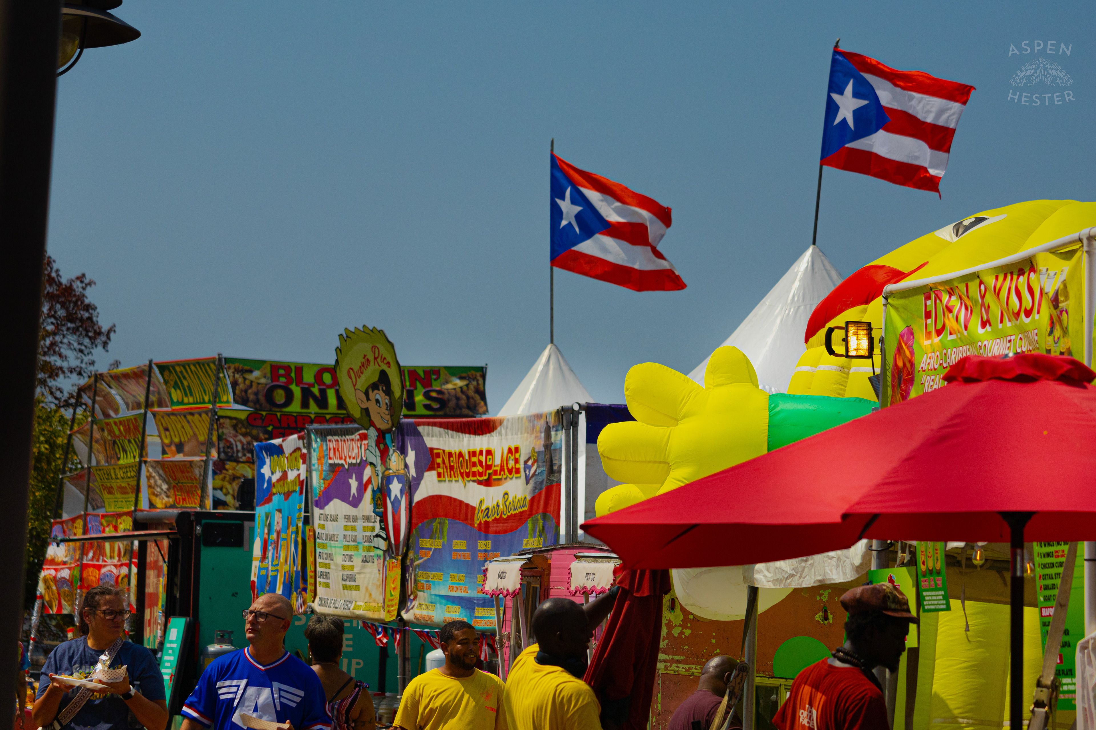 Cuban Flags Flying Over Venders at Opening Day of The 22nd Annual WorldFest. August 30th, 2024. Aspen Hester