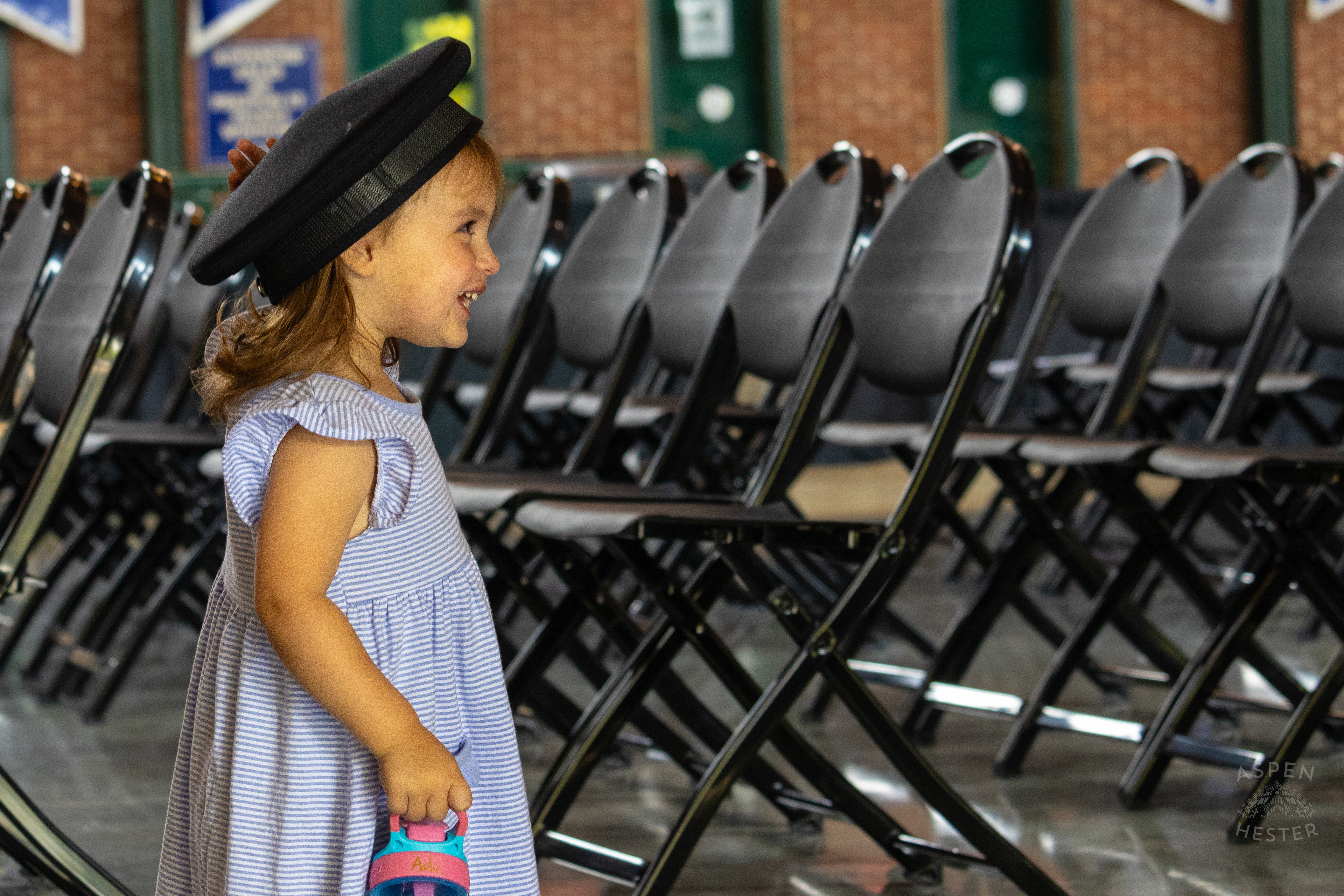  Child Plays with The Hat of A Recruit at The Graduation of MAC 59 into LMPD. August 30th, 2024Aspen Hester