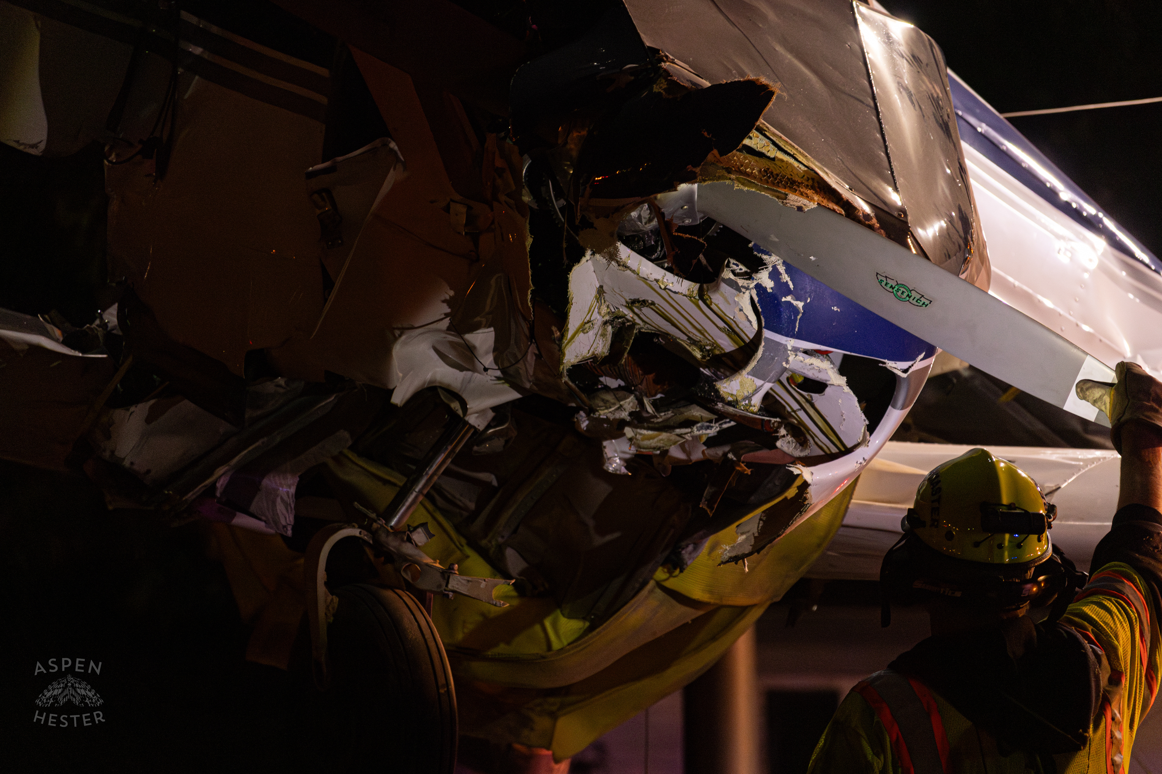 The Piper Cherokee Plane Being Lifted from the Road after it Crash Landed, Taking Out Utility Poles, and Hitting A Car on Breckenridge Lane and Kresge Way. October 11th, 2024/Aspen Hester 