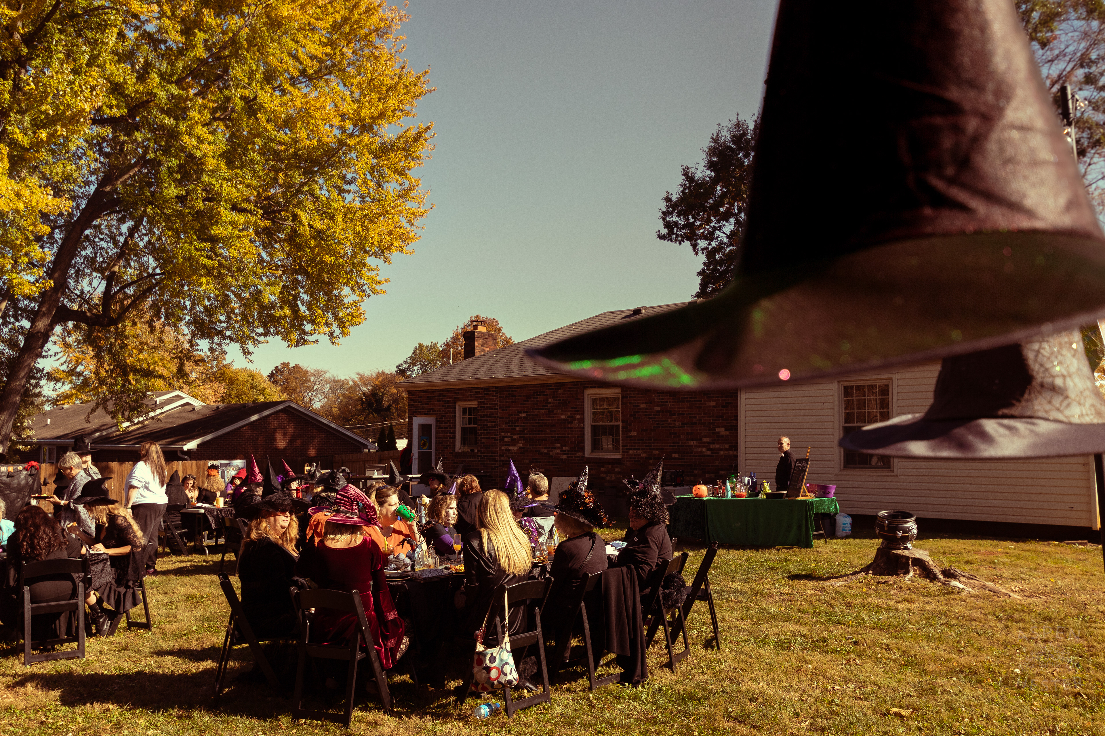 Witch Hats Floating Above Dozens of Women Attending Stacey Edrington’s Yearly Witches Brunch in Mt. Washington. October 26th, 2024/Aspen Hester