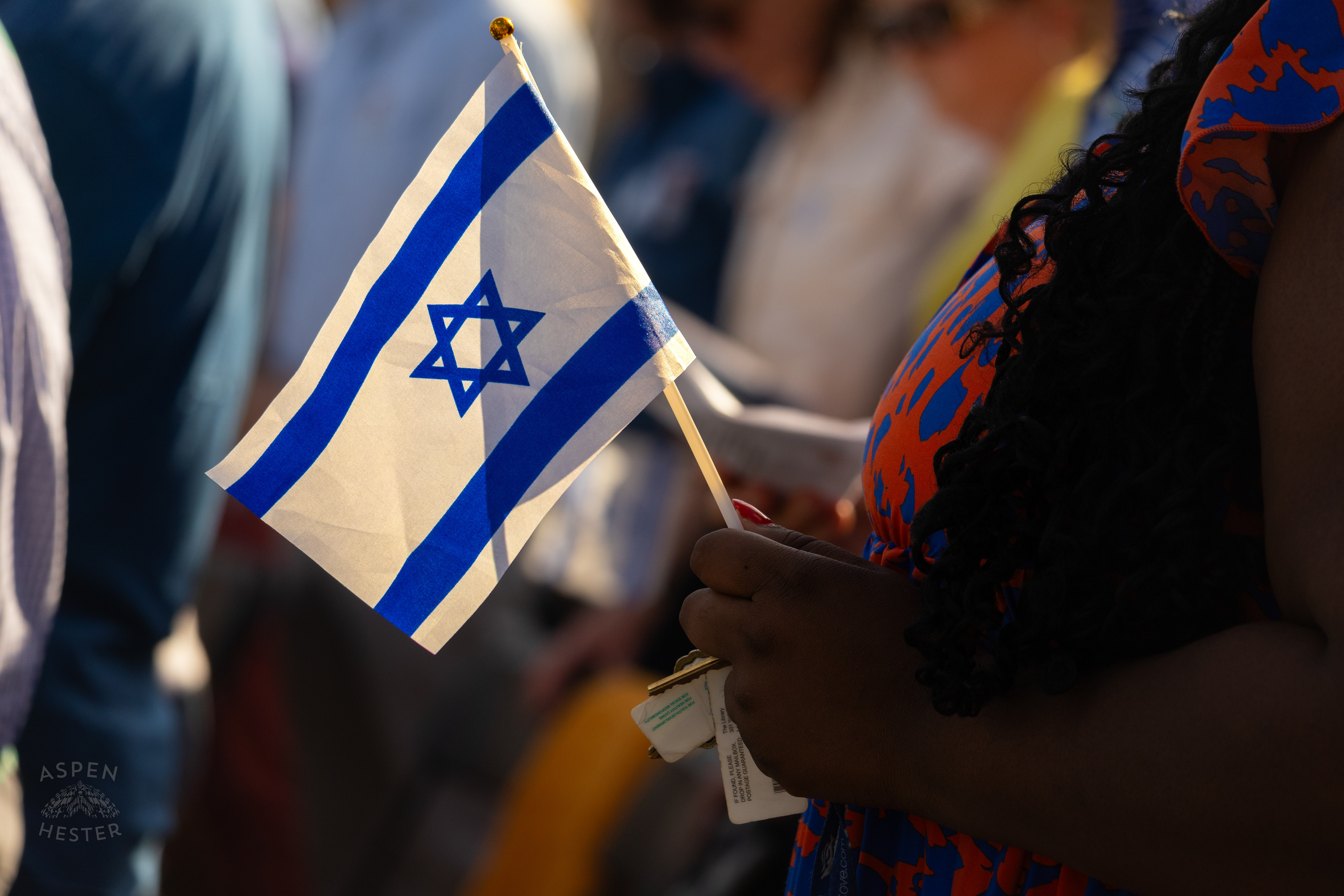 Someone Holds a Jewish Flag in The Crowd Gathered at The Trager Jewish Community Center to Remember The Victims and Pray for Peace One Year After The October 7th 2023 Hamas Attack. October 6th, 2024/Aspen Hester