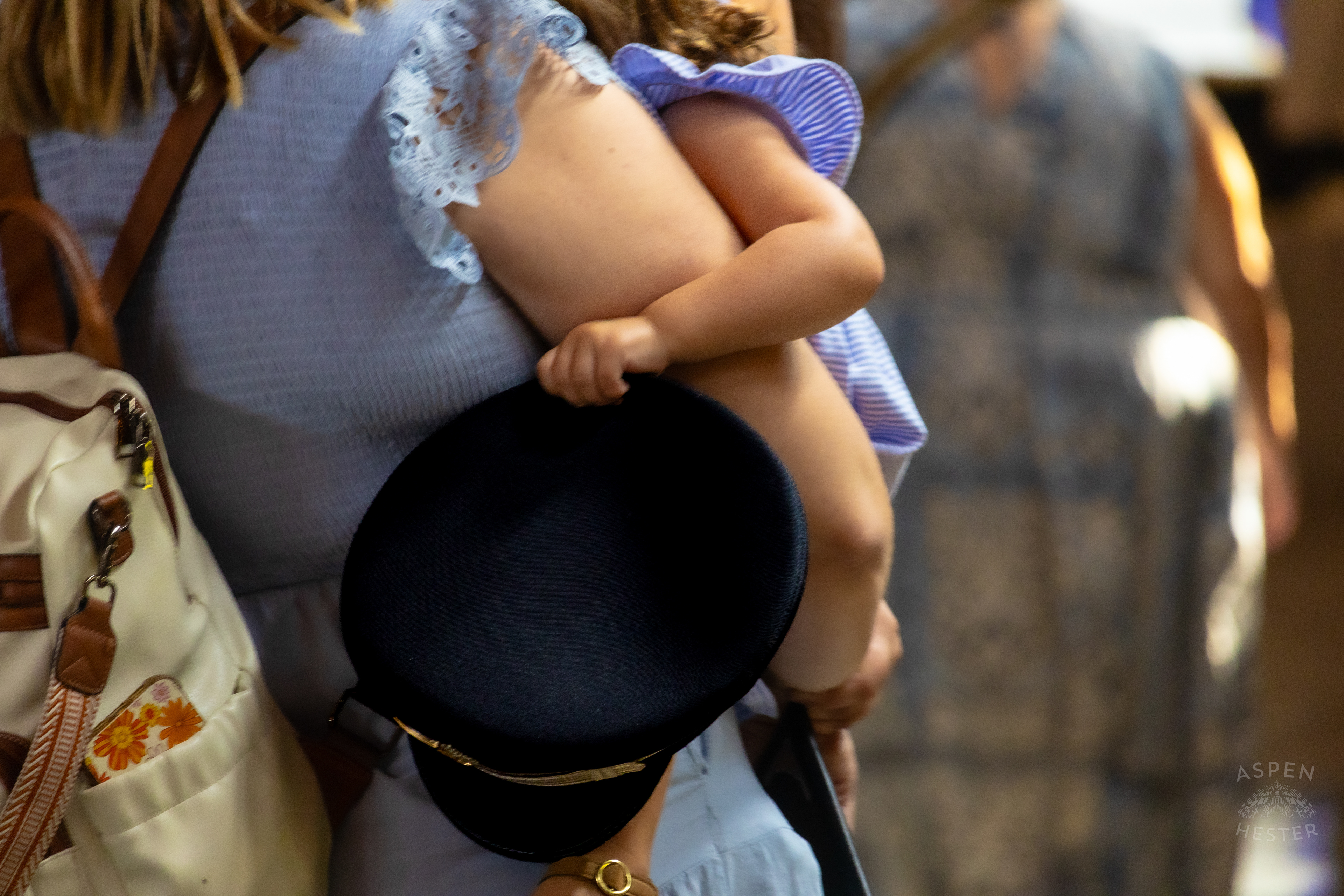  Child Plays with The Hat of A Recruit at The Graduation of MAC 59 into LMPD. August 30th, 2024Aspen Hester