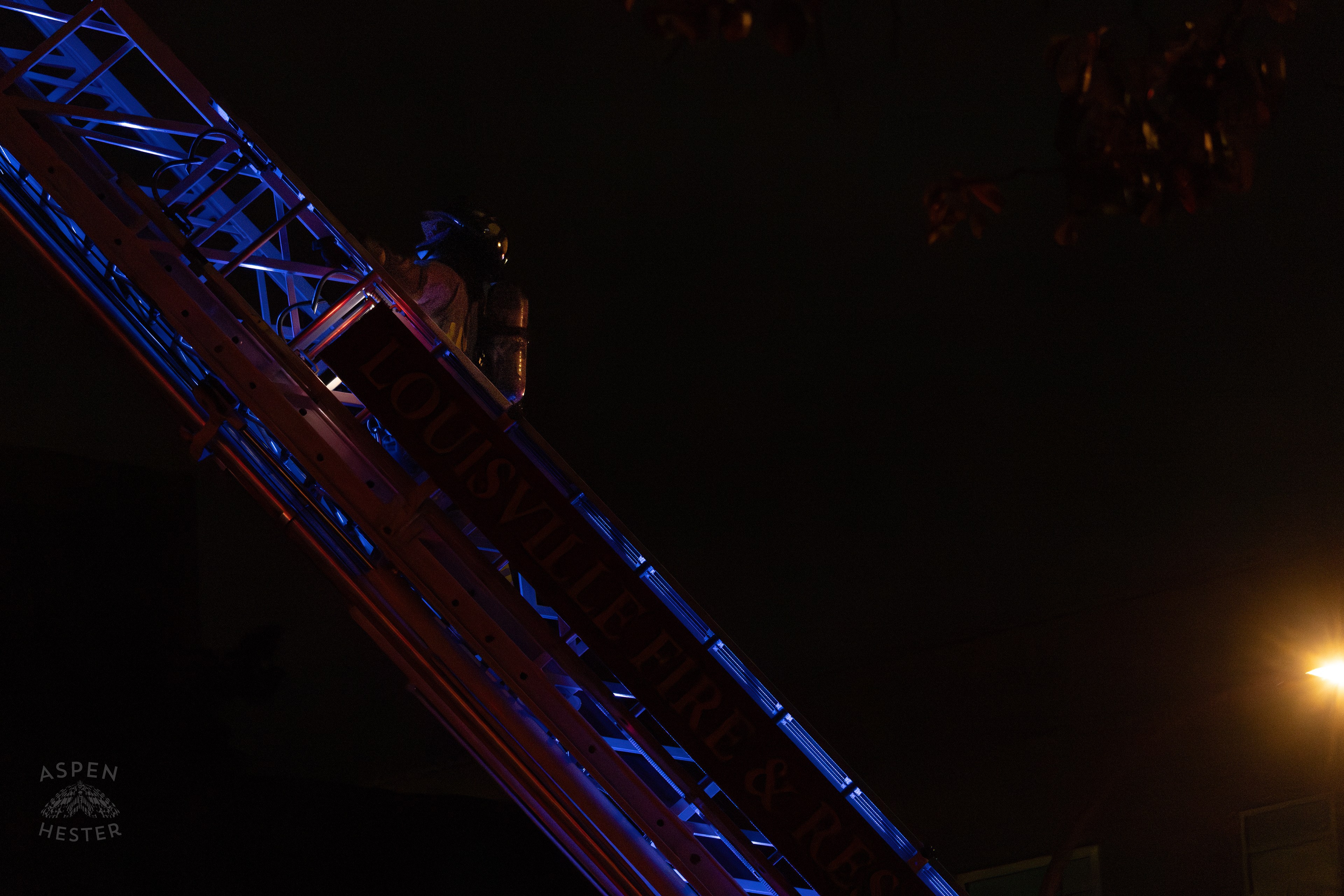 Firefighter Climbing an Aerial to Battle the Massive 3 Alarm Blaze Engulfing The Vacant St. Paul's German Evangelical Church on East Broadway. October 9th, 2024/Aspen Hester