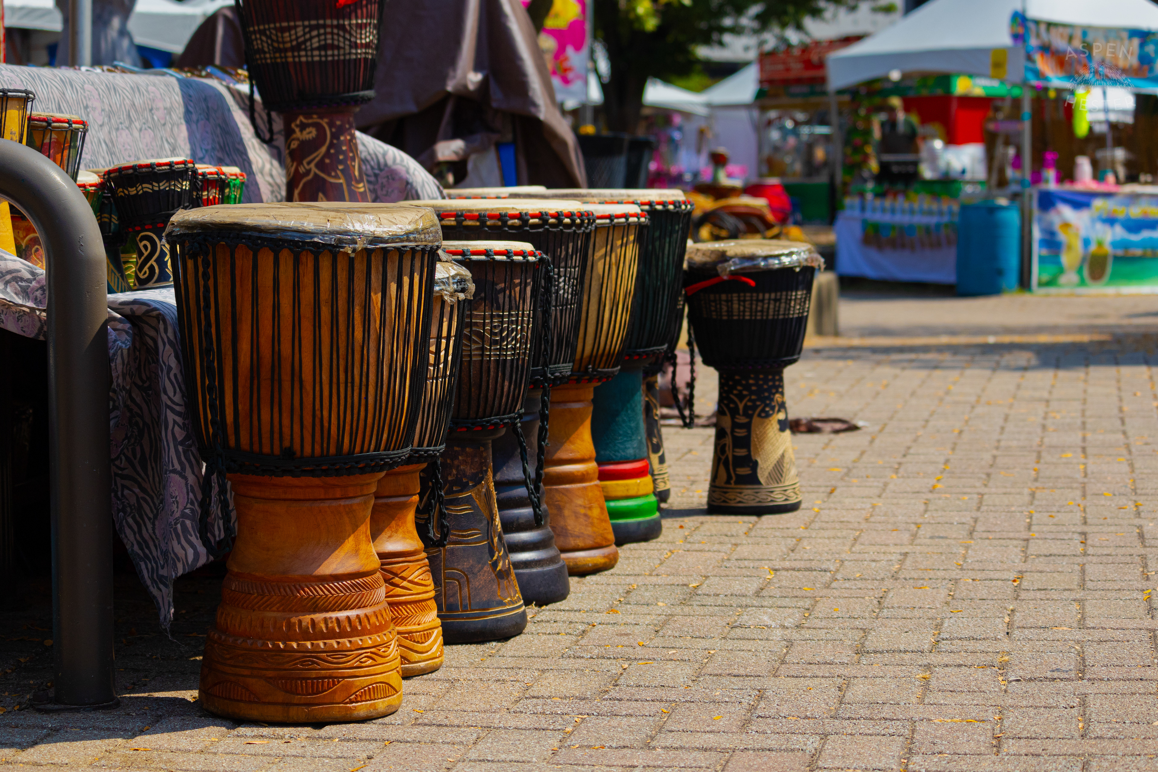 Djembe's Being Sold by African Art at Opening Day of The 22nd Annual WorldFest. August 30th, 2024. Aspen Hester