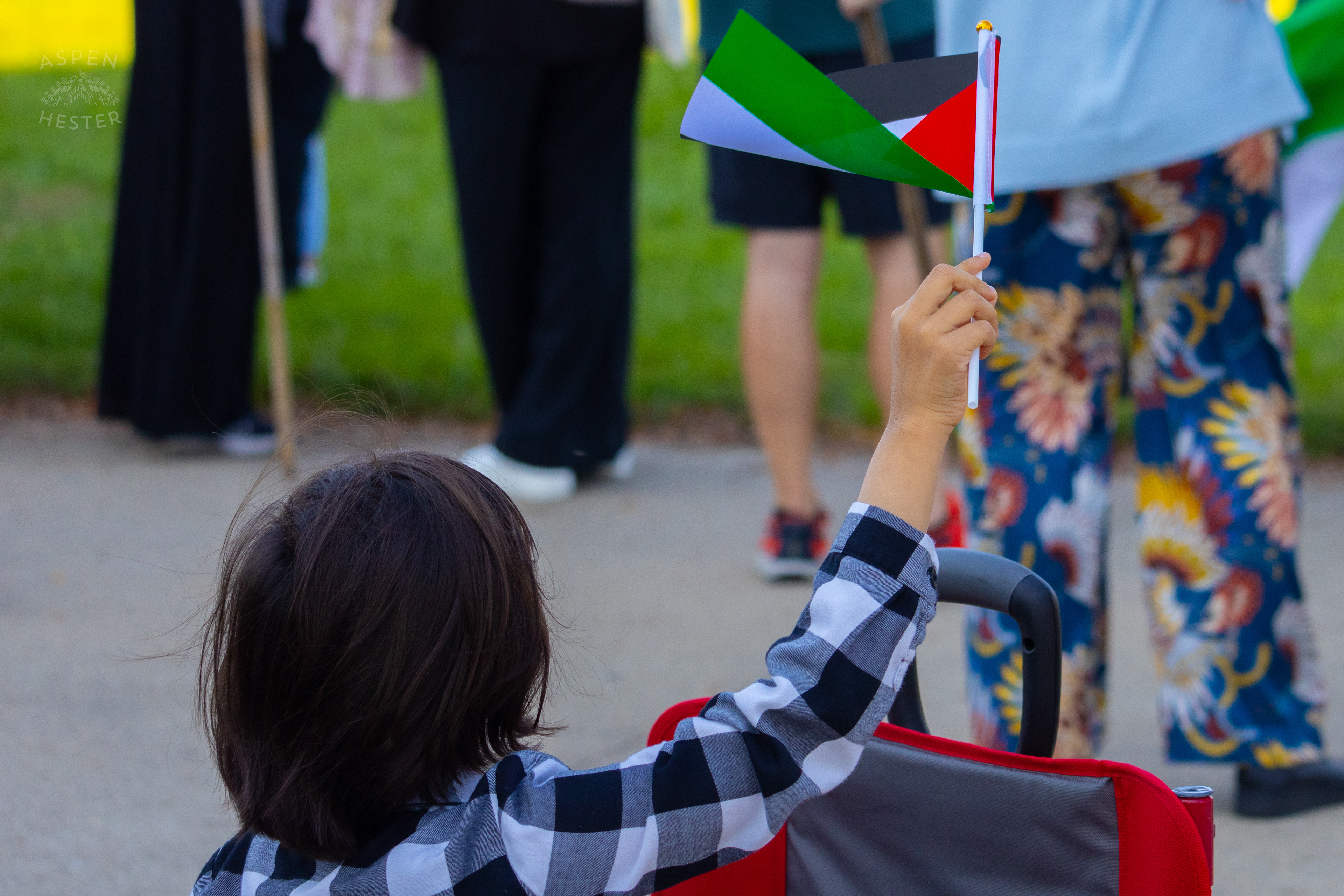 A Child Proudly Waves A Palestinian Flag During Lousiville’s One Year of Gaza Genocide Rally. October 5th, 2024/Aspen Hester 