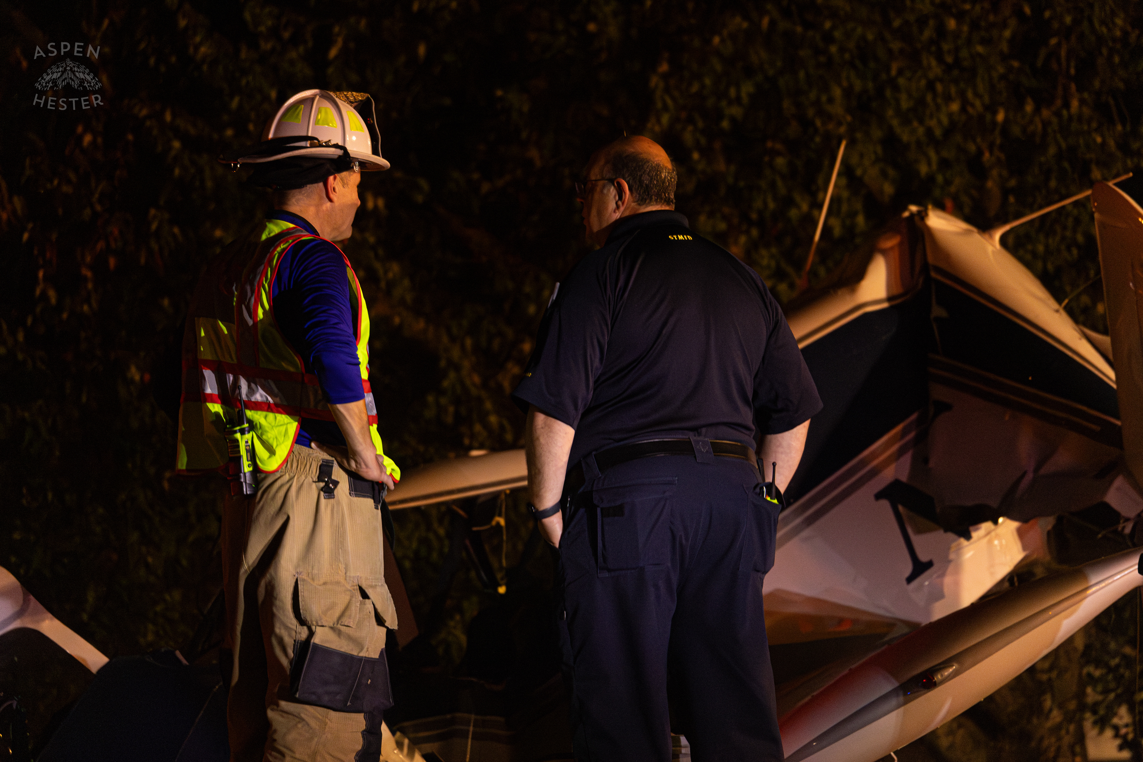 St. Matthews Firefighters and Police Watching Over The Scene Where A Piper Cherokee Plane Crash Landed, Taking Out Utility Poles, and Hitting A Car on Breckenridge Lane and Kresge Way. October 11th, 2024/Aspen Hester 