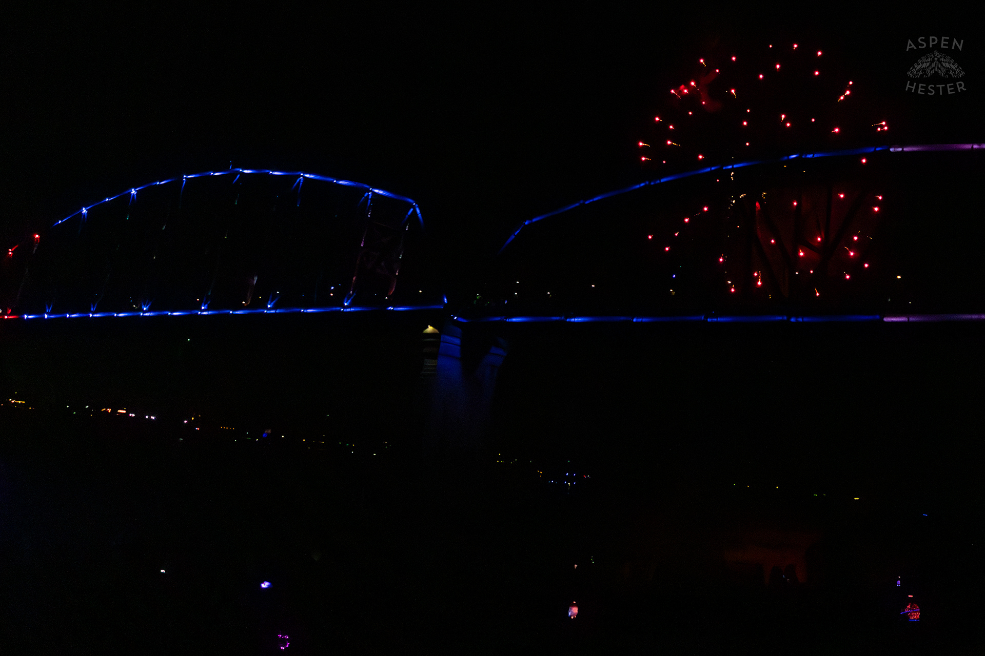 The Big Four Bridge and Attendees During The Fireworks Show at Waterfront Park Fourth of July. July 4th, 2024/Aspen Hester