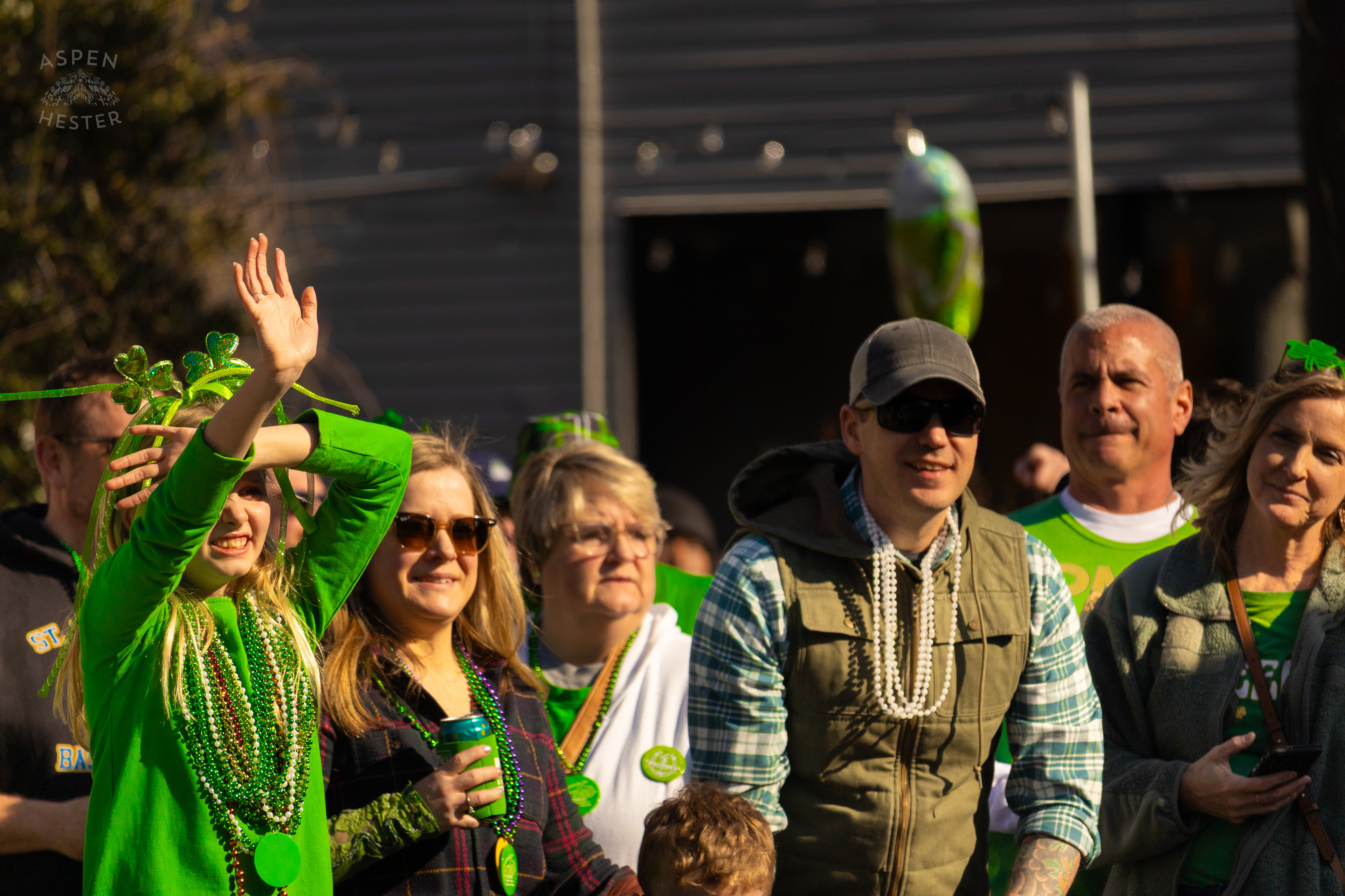 Spectators Wave to Marchers as The 52nd Annual Saint Patrick’s Day Parade Rolls Through The Highlands. March 8th, 2025/Aspen Hester