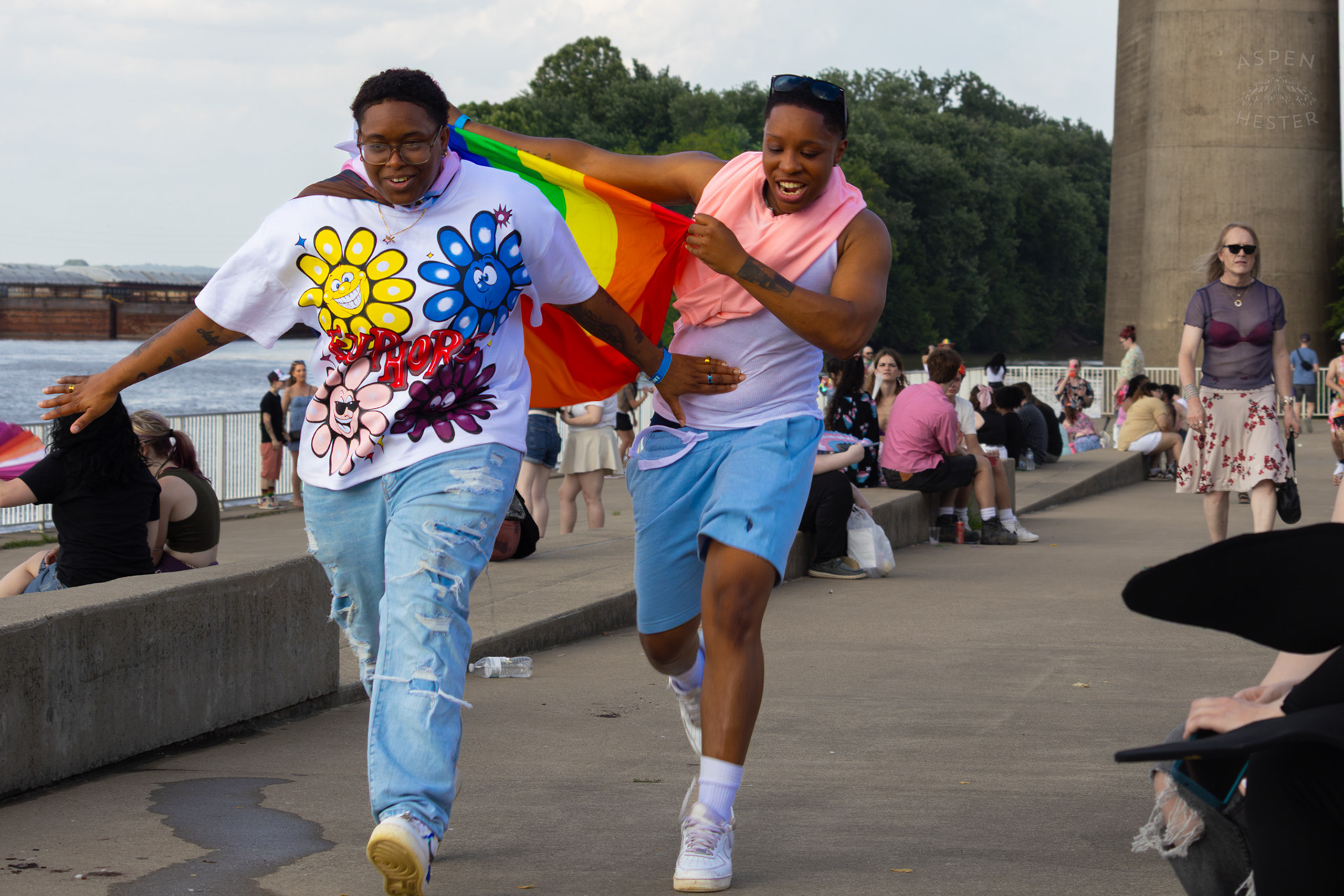 A Prideful Superhero Getting A Little Help To Lift Off The Ground at Kentuckiana Pride 2025. June 21th, 2025/Aspen Hester 