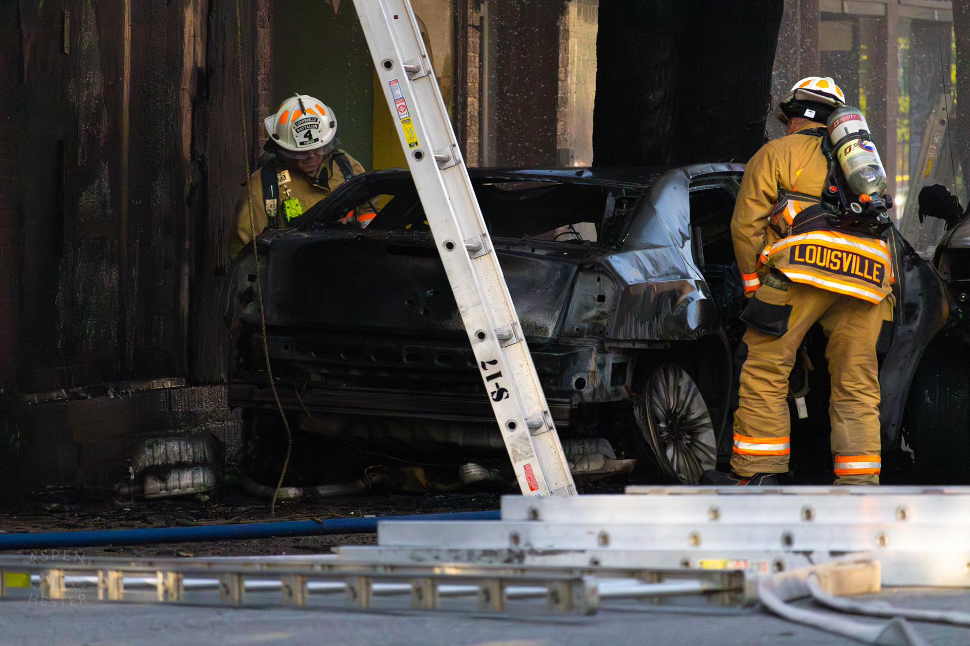 Louisville Firefighters Inspect the Remains of A Fiery Crash on The Corner of 2nd and Oak Street. June 7th, 2024/Aspen Hester