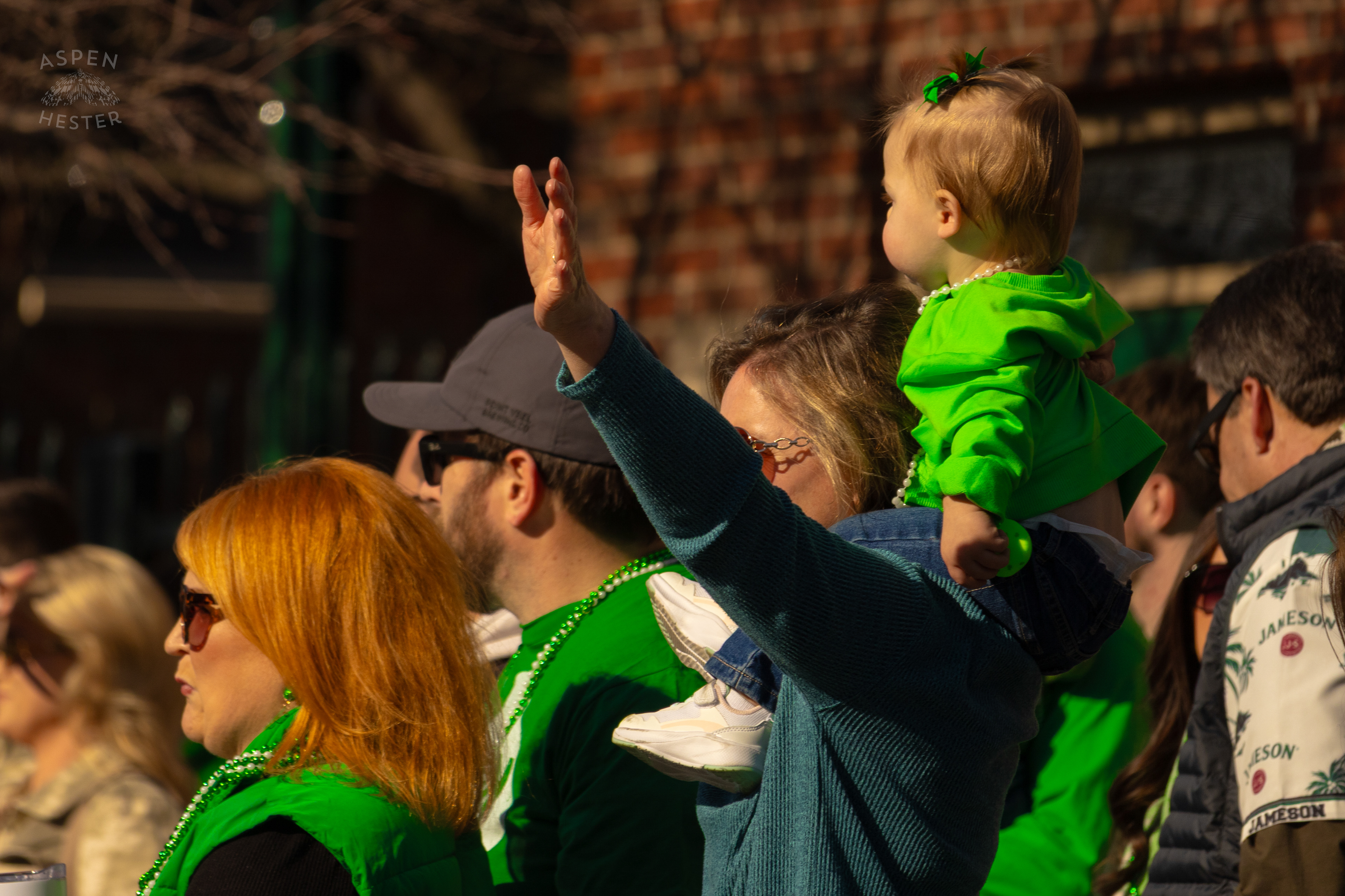 A Toddler Getting A Better View of The Festivities as The 52nd Annual Saint Patrick’s Day Parade Rolls Through The Highlands. March 8th, 2025/Aspen Hester