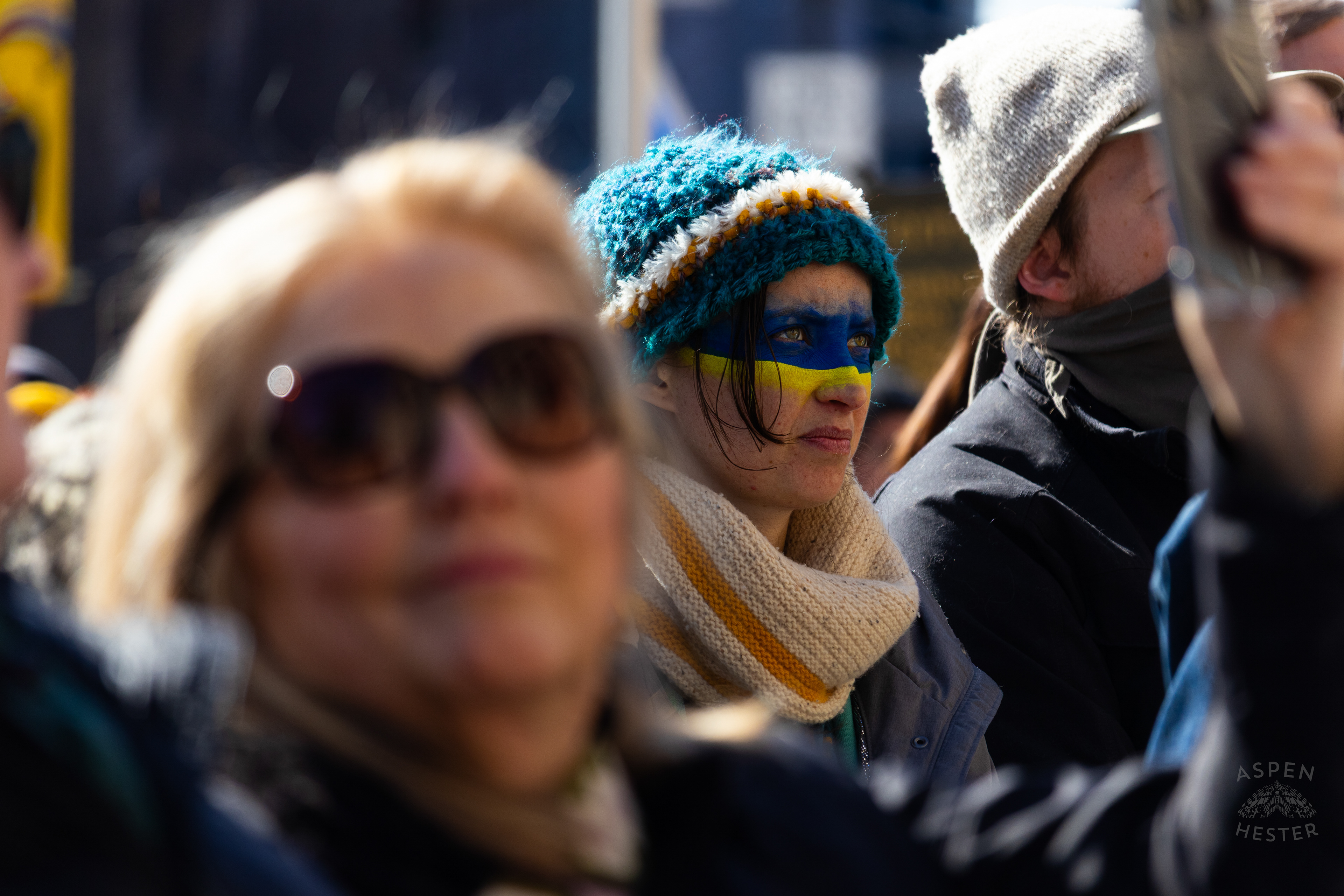 A Louisvillian Wears The Colors of The Ukrainian Flag on Their Face as The Community Rallies in Support of Ukraine. March 2nd, 2025/Aspen Hester