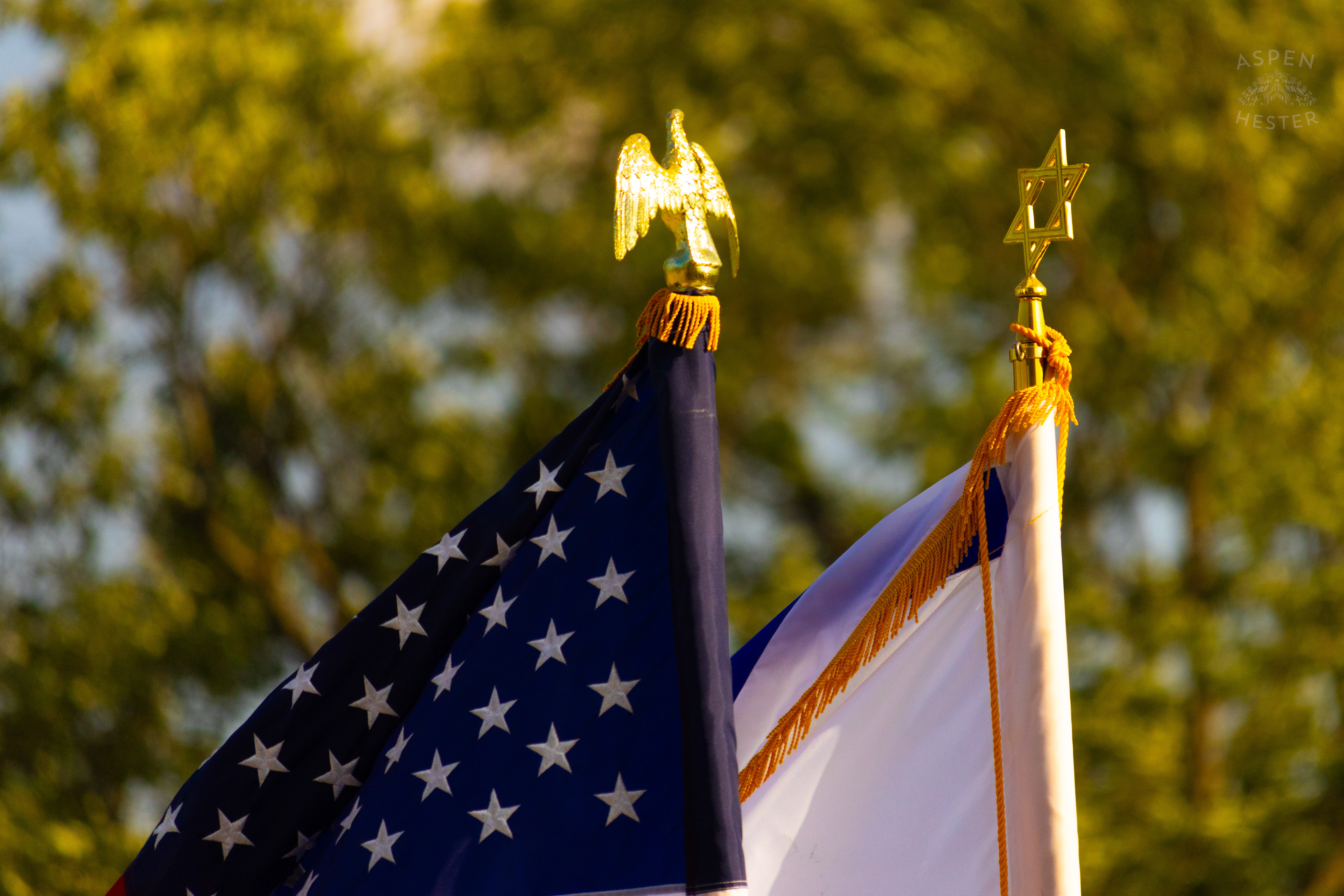 Jewish and American Flags Fly Over The Crowd Gathered at The Trager Jewish Community Center to Remember The Victims and Pray for Peace One Year After The October 7th 2023 Hamas Attack. October 6th, 2024/Aspen Hester