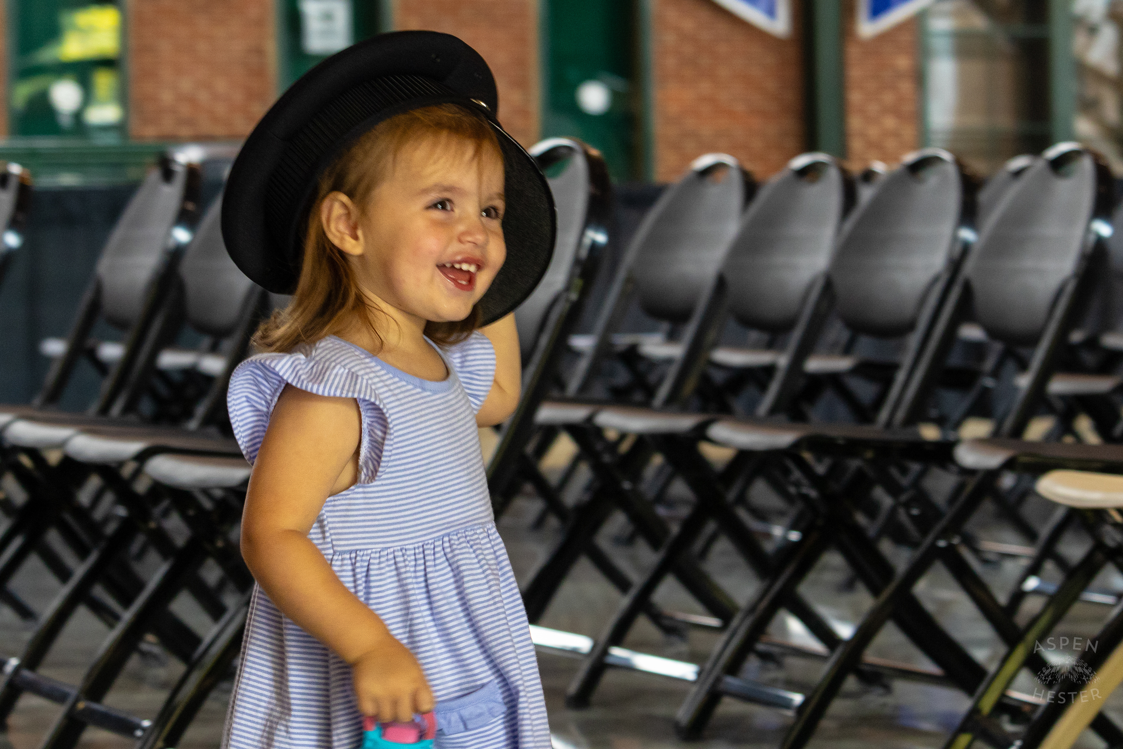  Child Plays with The Hat of A Recruit at The Graduation of MAC 59 into LMPD. August 30th, 2024Aspen Hester