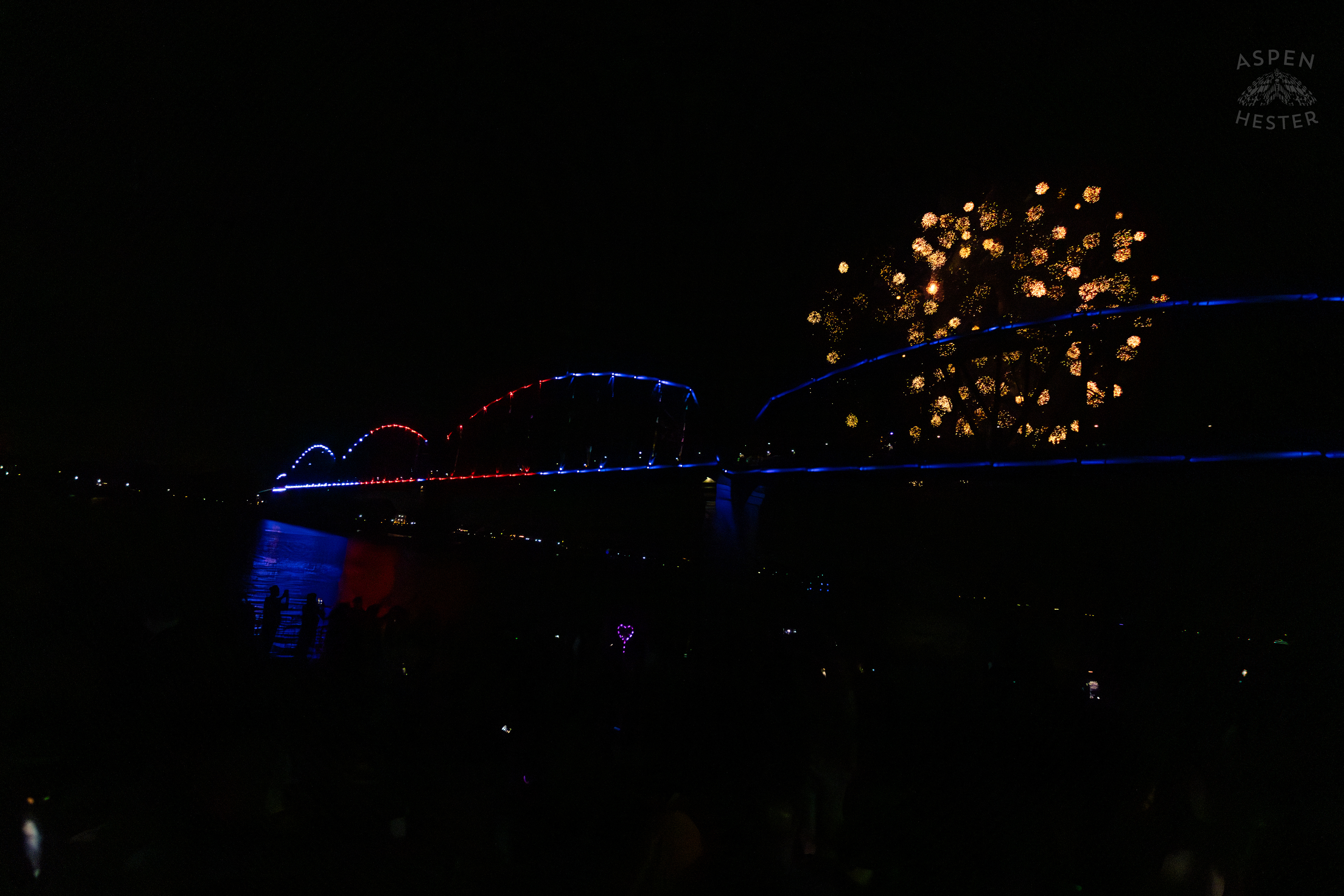 The Big Four Bridge and Attendees During The Fireworks Show at Waterfront Park Fourth of July. July 4th, 2024/Aspen Hester