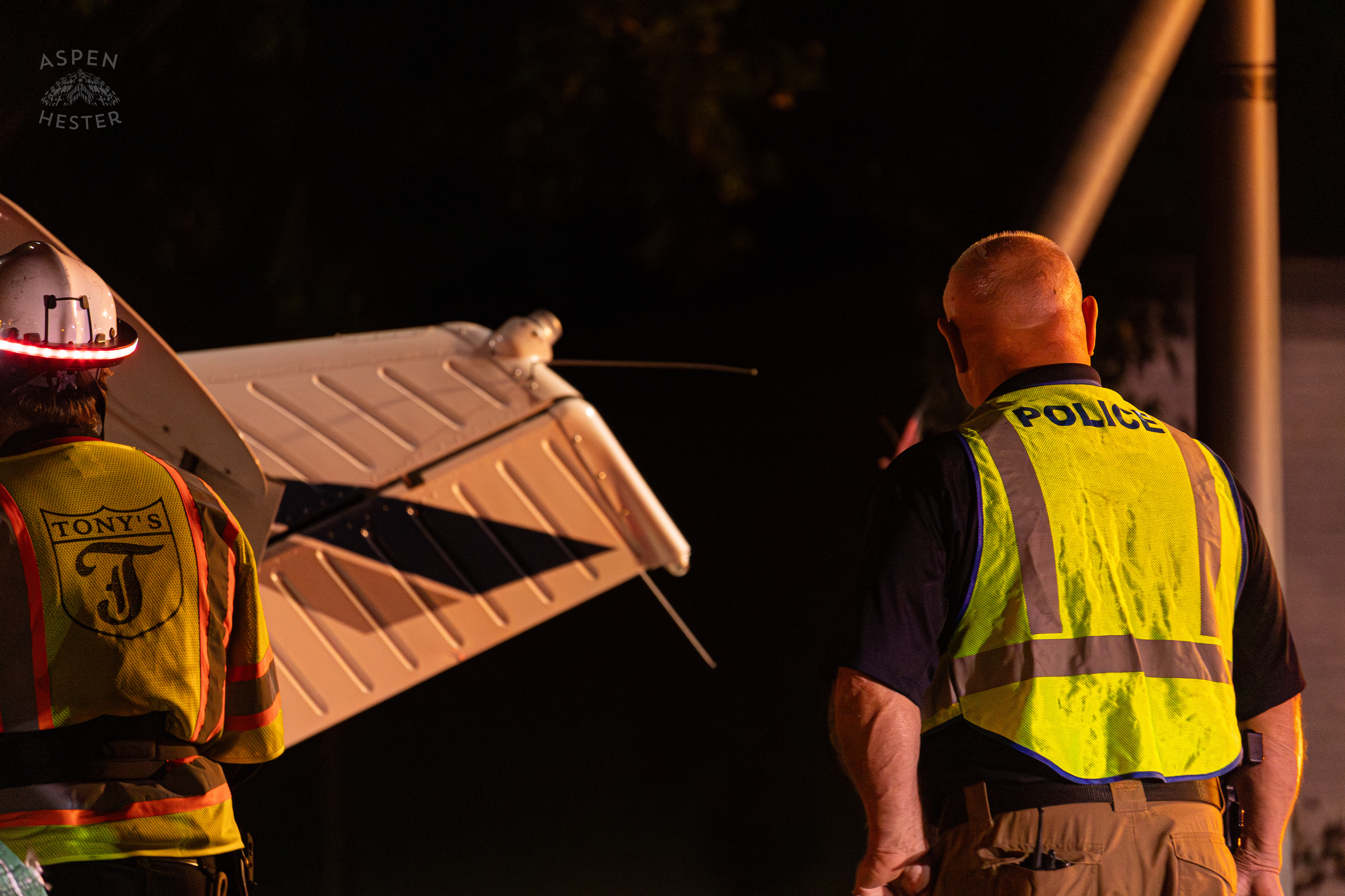 St. Matthews Police Watching as A Tony’s Wreckers Crew Works to Remove The Piper Cherokee Plane from the Road after it Crash Landed, Taking Out Utility Poles, and Hitting A Car on Breckenridge Lane and Kresge Way. October 11th, 2024/Aspen Hester