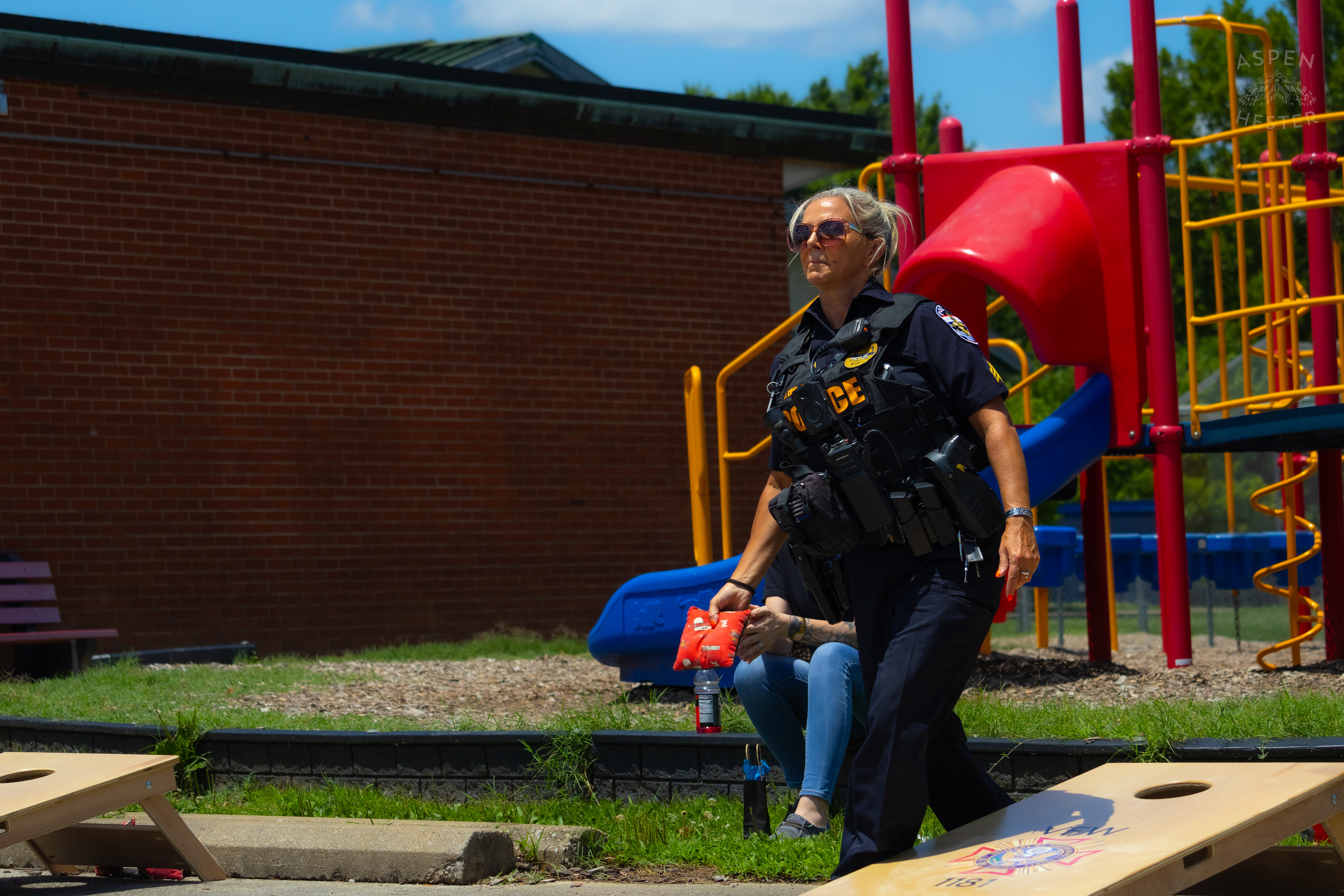 LMPD Officer Carmine Zoeller Participates in "Cornhole with Cops" Event. July 6th, 2024/Aspen Hester