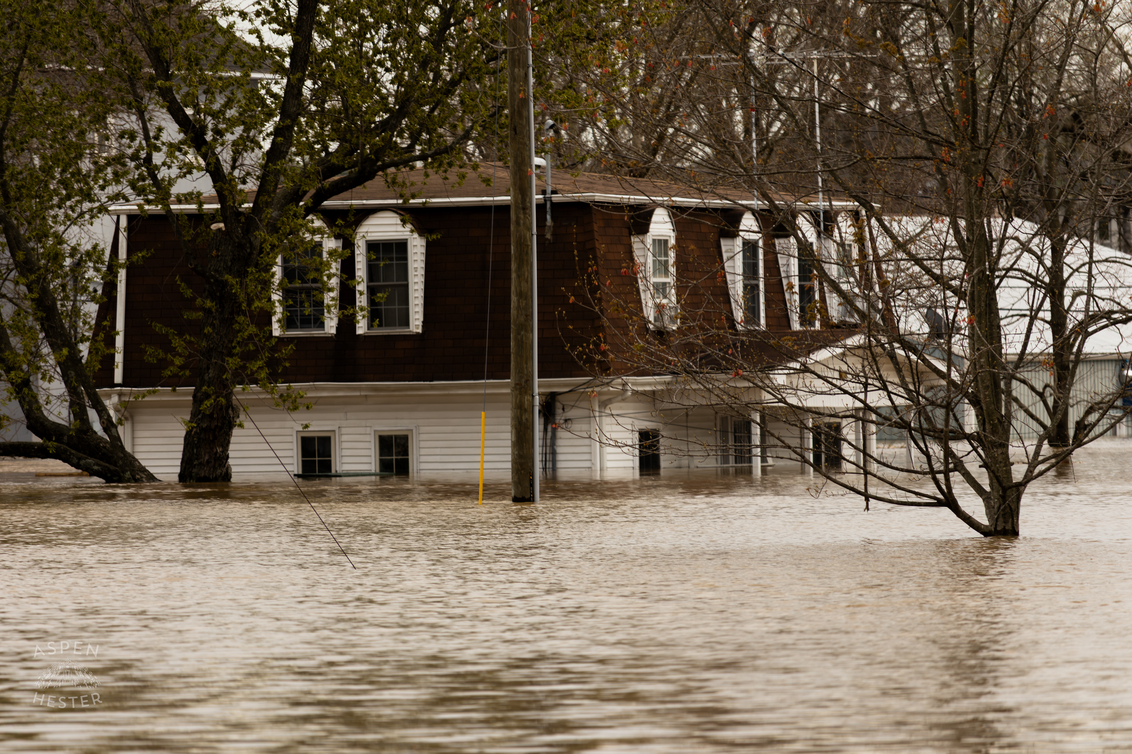 A Home on 3rd Street Sits Submerged in Water Amid The Historic Flooding in Utica Indiana. April 9th, 2025/Aspen Hester