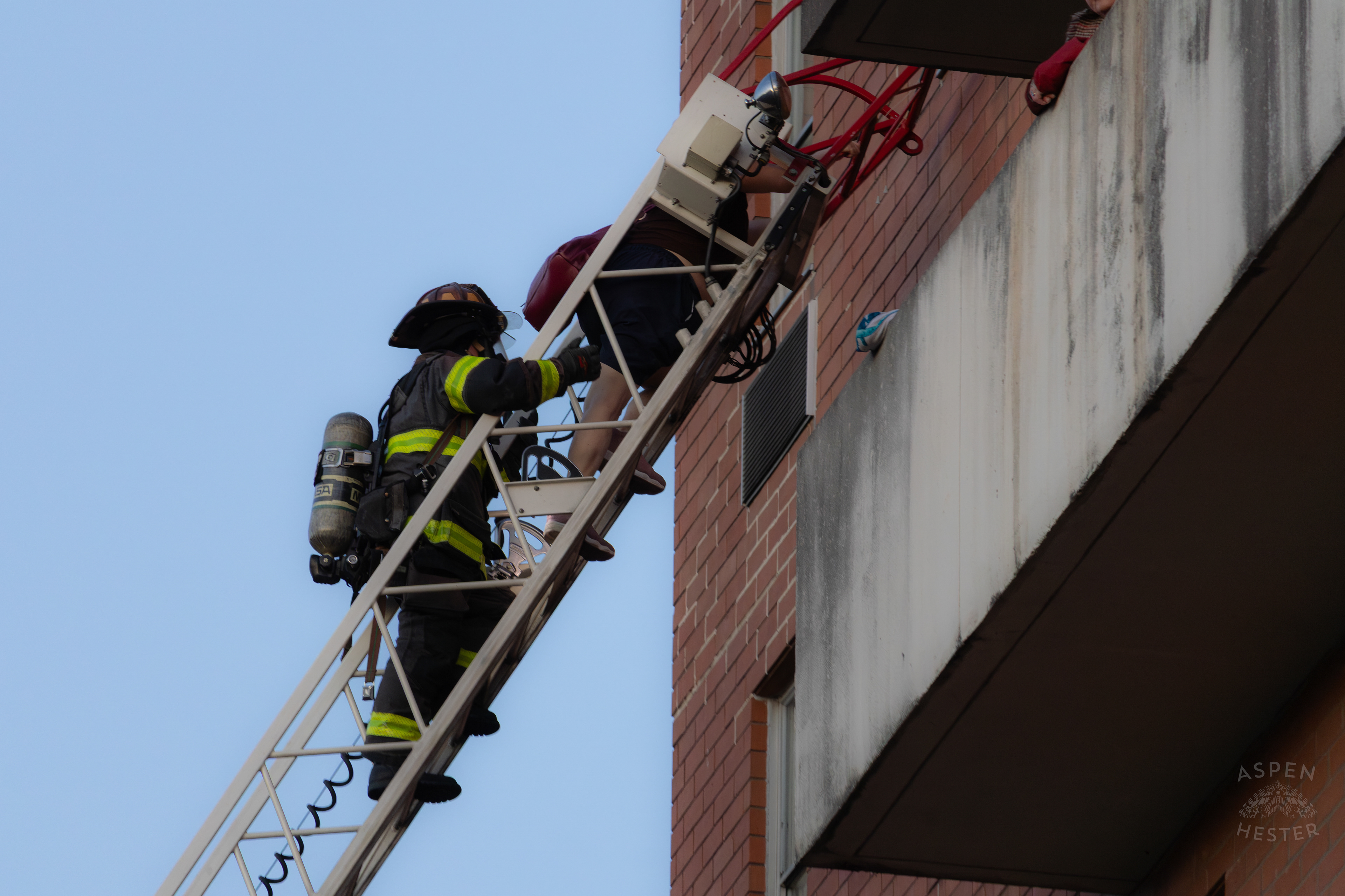 Firefighters Save A Trapped Resident on A High Floor From The Parkview Tower Fire in New Albany Indiana. March 22nd, 2025/Aspen Hester