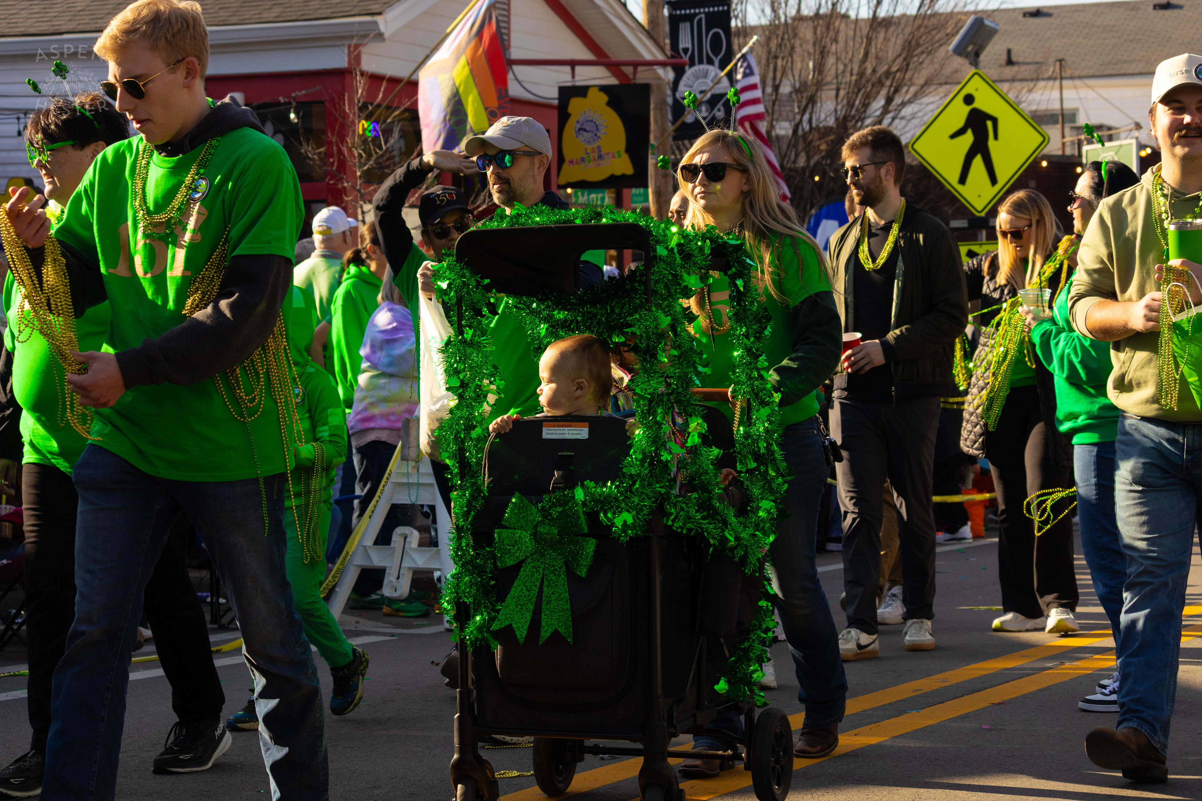 Toddlers Ride Along with Churchill Downs as The 52nd Annual Saint Patrick’s Day Parade Rolls Through The Highlands. March 8th, 2025/Aspen Hester