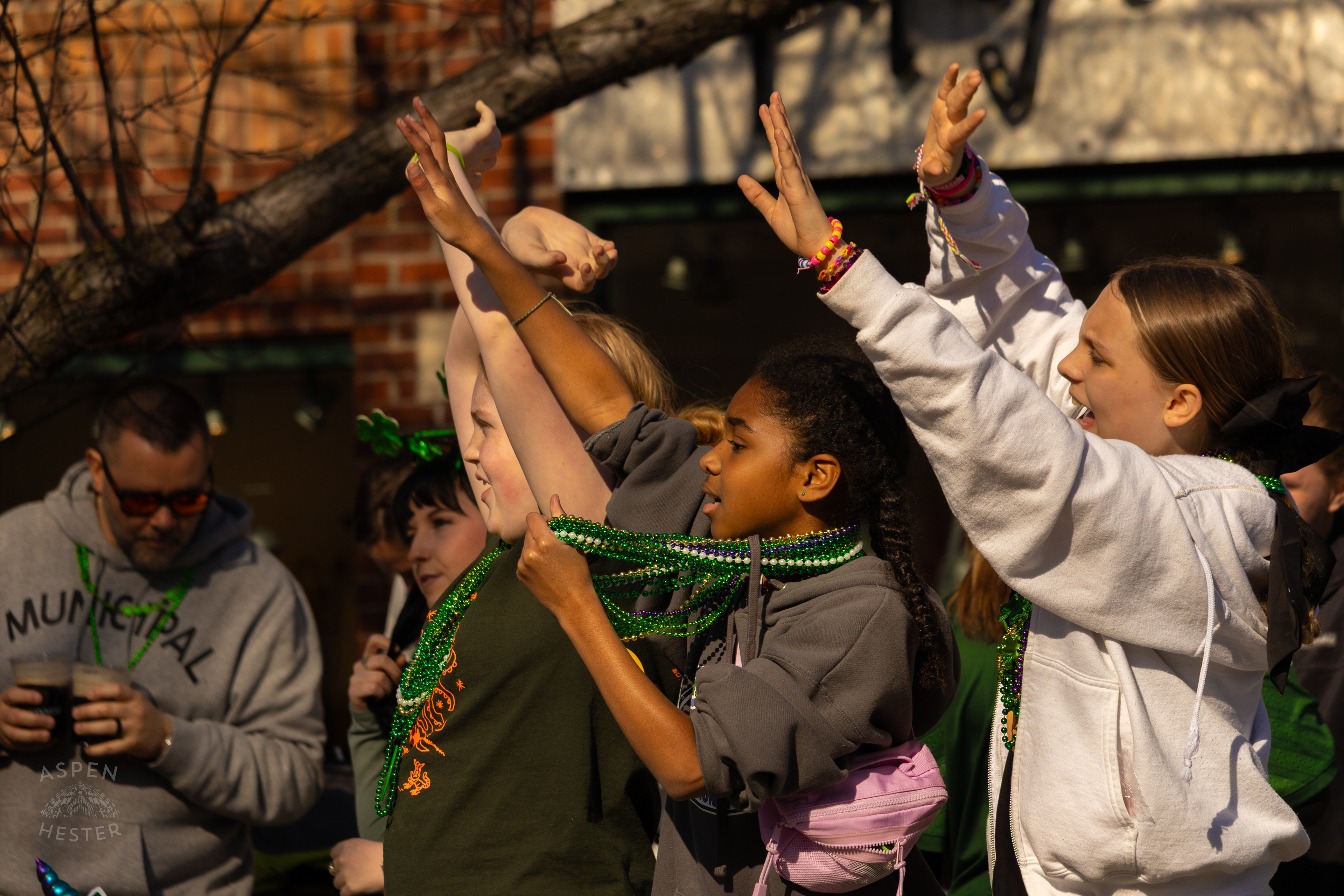 Kids Yell and Shout for Beads as The 52nd Annual Saint Patrick’s Day Parade Rolls Through The Highlands. March 8th, 2025/Aspen Hester