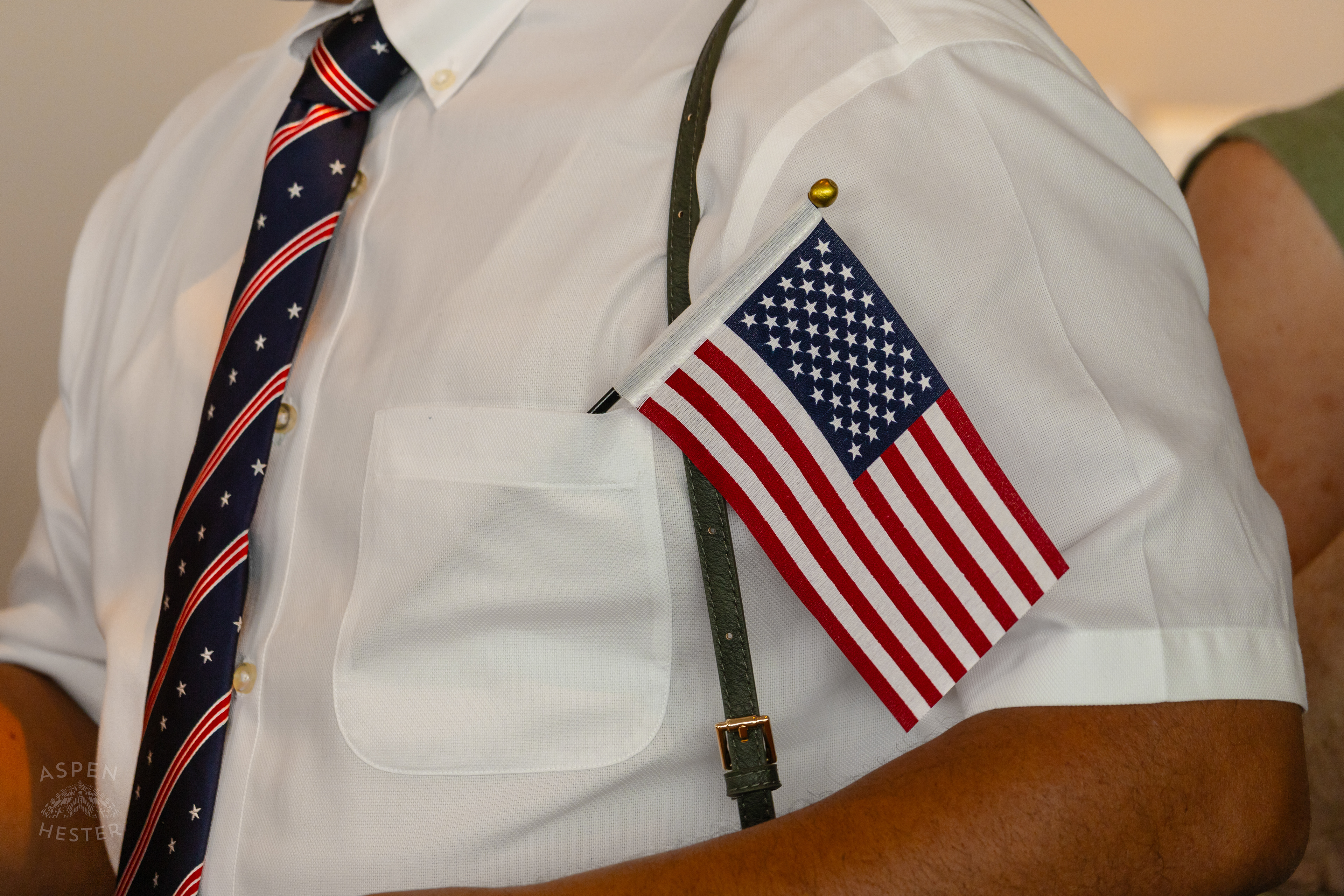 Jose Castro from Peru's Star Spangled Tie and American Flag After WorldFest's Naturalization Ceremony. August 30th, 2024/Aspen Hester