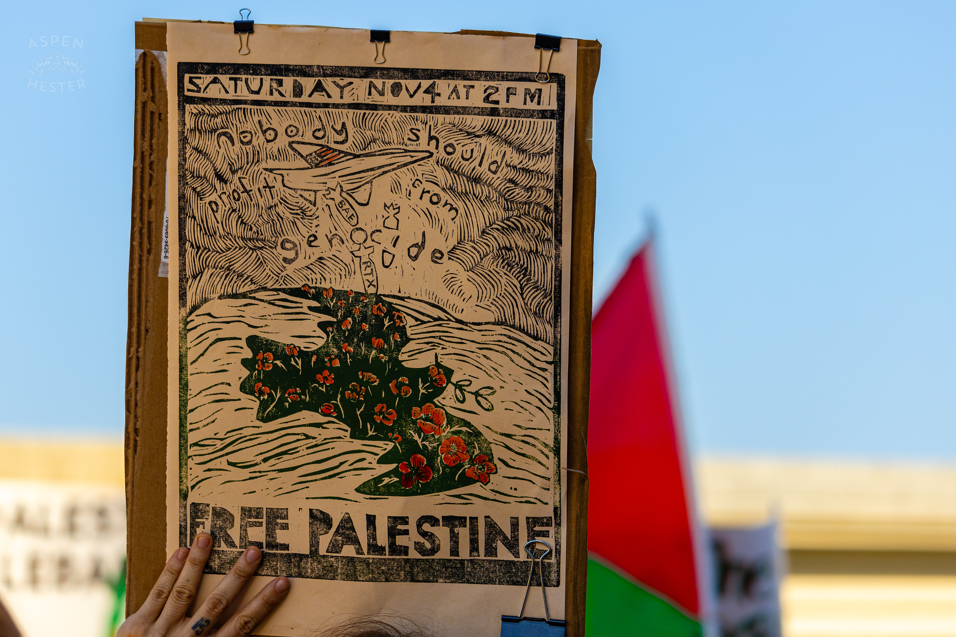 Protesters Saying “No One Should Benefit From Genocide” During Lousiville’s One Year of Gaza Genocide Rally. October 5th, 2024/Aspen Hester 