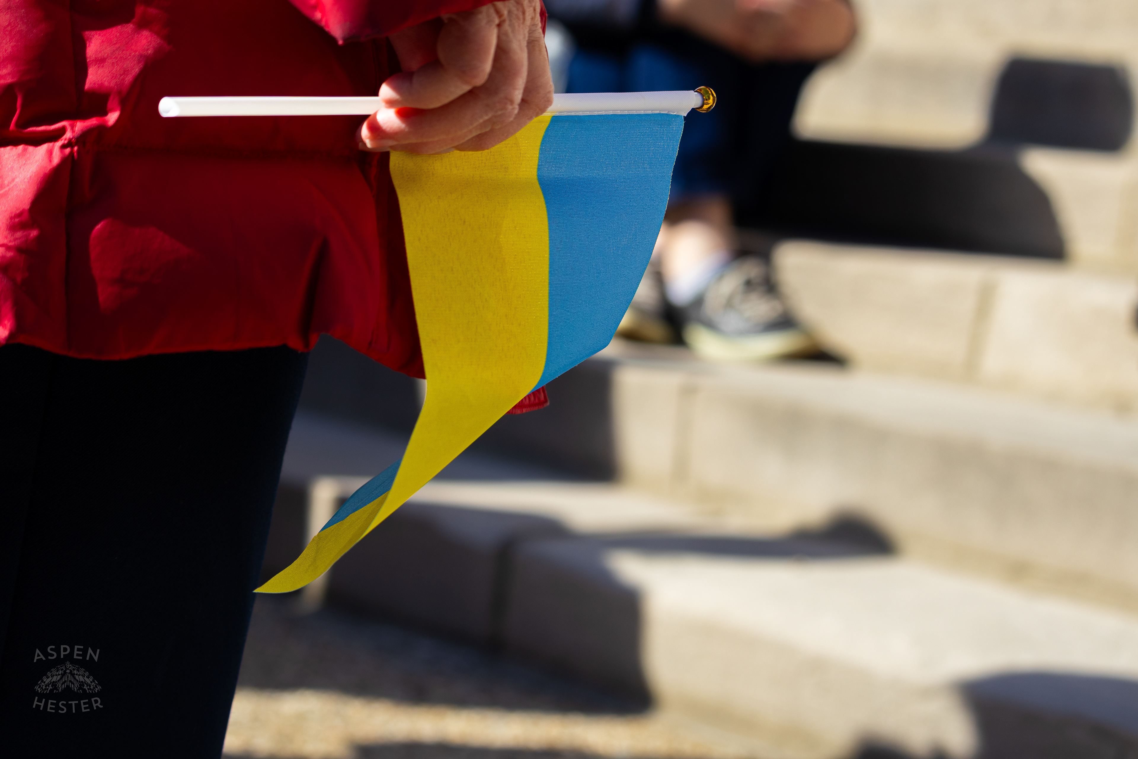 A Louisvillian Holds A Ukrainian Flag as The Community Rallies in Support of Ukraine. March 2nd, 2025/Aspen Hester