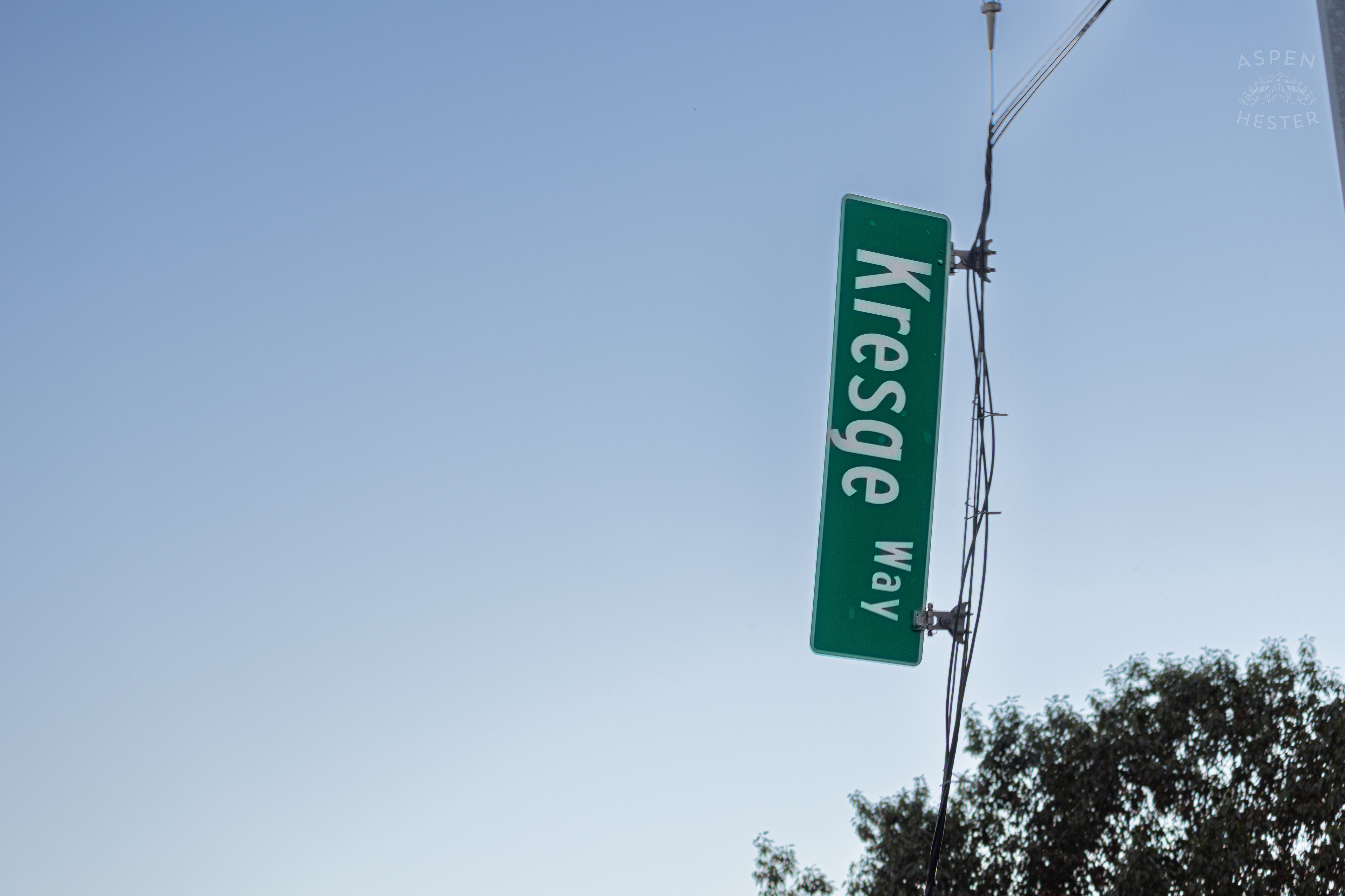 The Dangling Sign for Kresge Way after A Piper Cherokee Plane Crash Landed, Taking Out Utility Poles, and Hitting A Car on Breckenridge Lane and Kresge Way. October 11th, 2024/Aspen Hester 