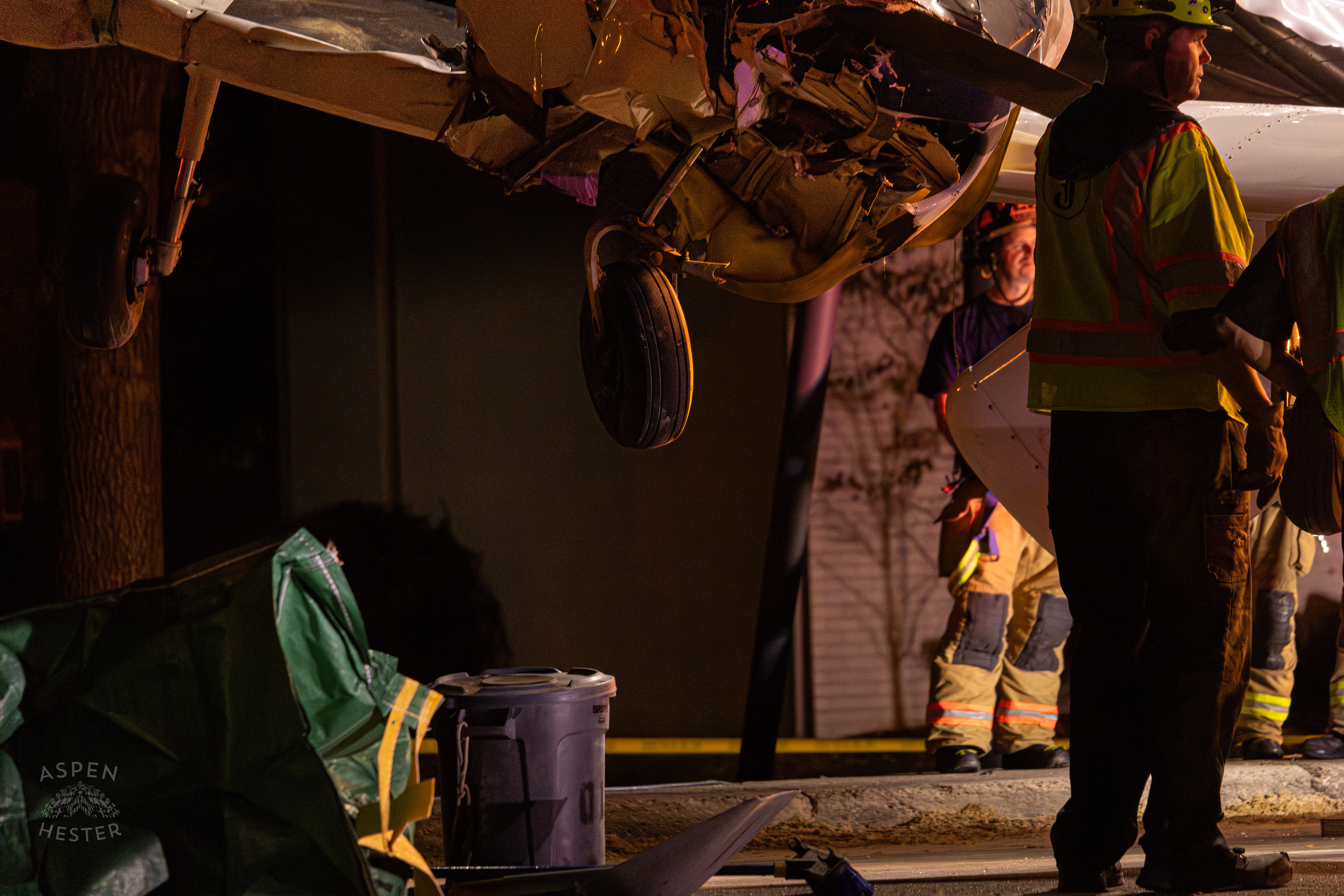 The Piper Cherokee Plane Being Lifted from the Road after it Crash Landed, Taking Out Utility Poles, and Hitting A Car on Breckenridge Lane and Kresge Way. October 11th, 2024/Aspen Hester 