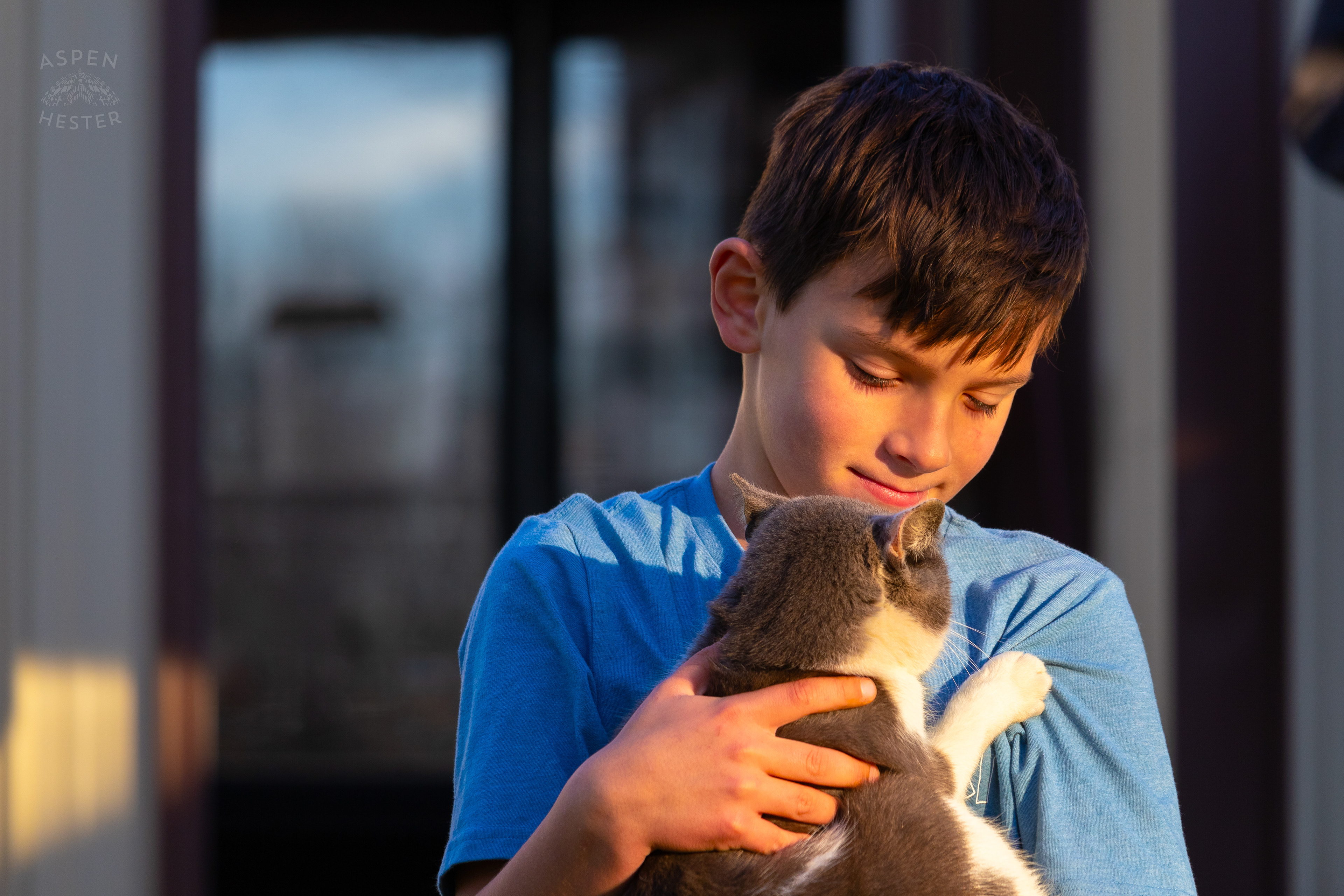 Tilden Skinner Cuddling Barn Cat Catboy on Skinner Farms Thanksgiving Turkey Pick Up Day. November 24th, 2024/Aspen Hester