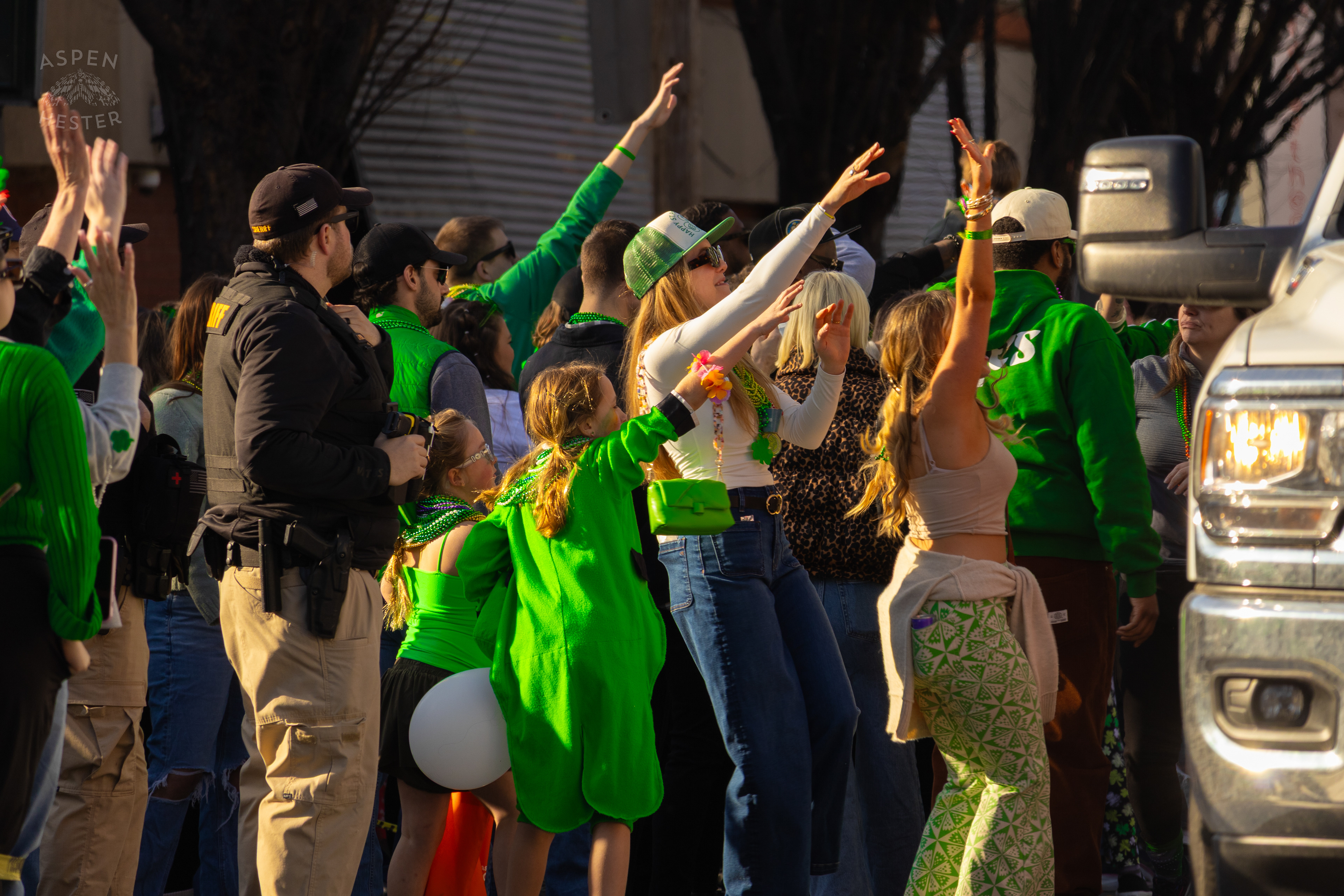 Spectators Cheer and Yell for Beads as The 52nd Annual Saint Patrick’s Day Parade Rolls Through The Highlands. March 8th, 2025/Aspen Hester