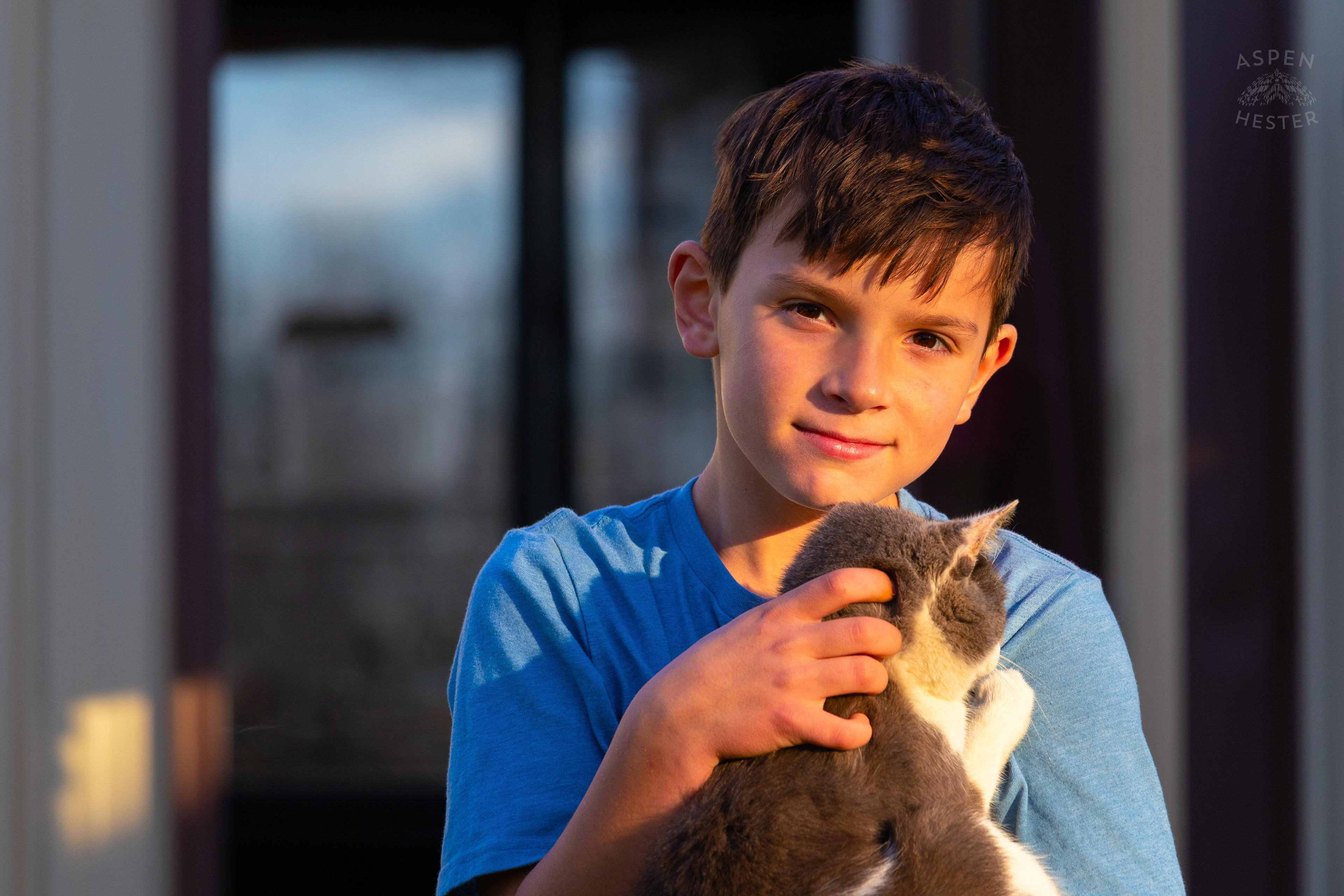 Tilden Skinner Cuddling Barn Cat Catboy on Skinner Farms Thanksgiving Turkey Pick Up Day. November 24th, 2024/Aspen Hester