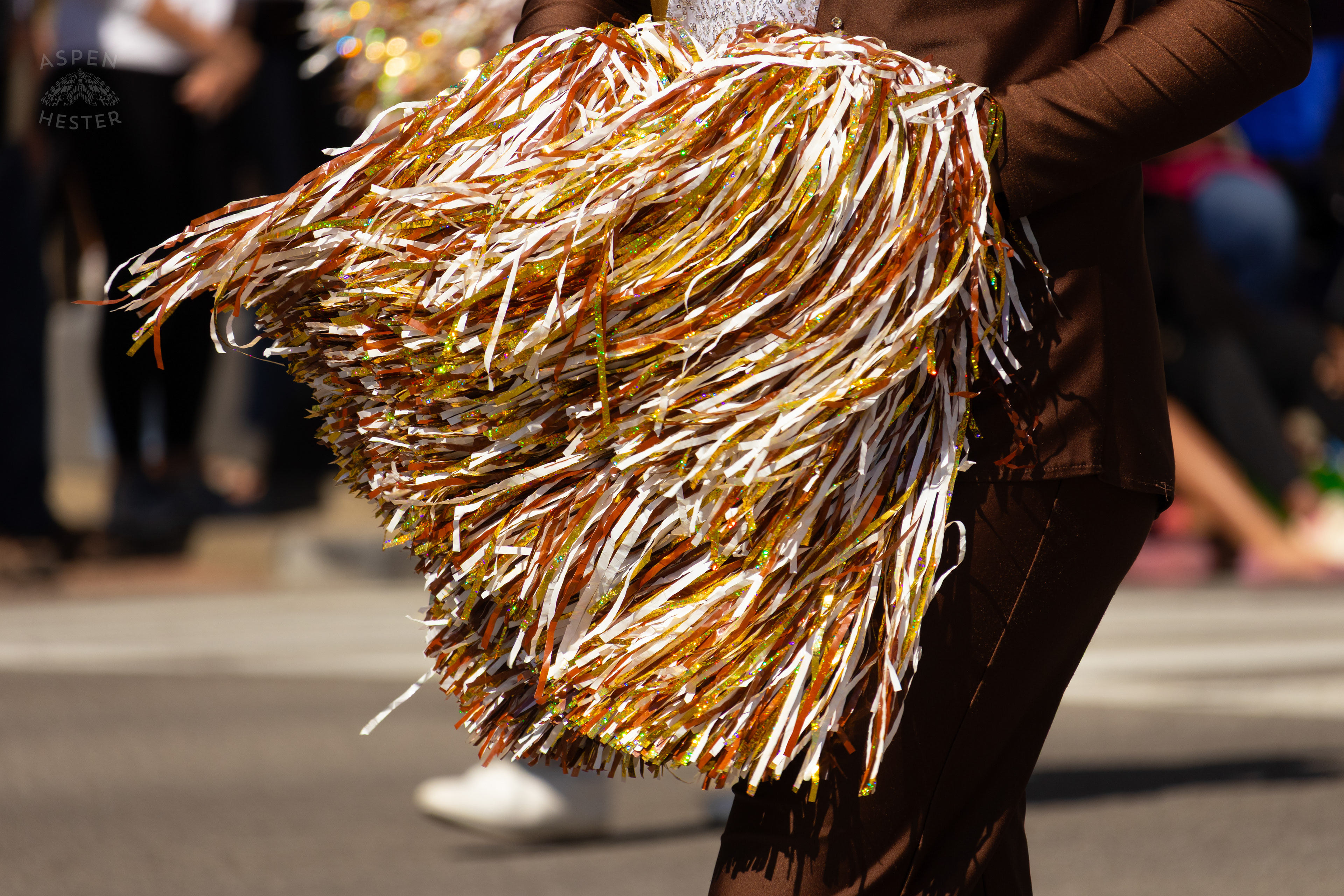 The Giant Pom Poms of The Cheerleaders with The Highlands Varsity Marching Band as They Make Their Way Down West Broadway for The 70th Annual Pegasus Parade. April 27th, 2025/Aspen Hester