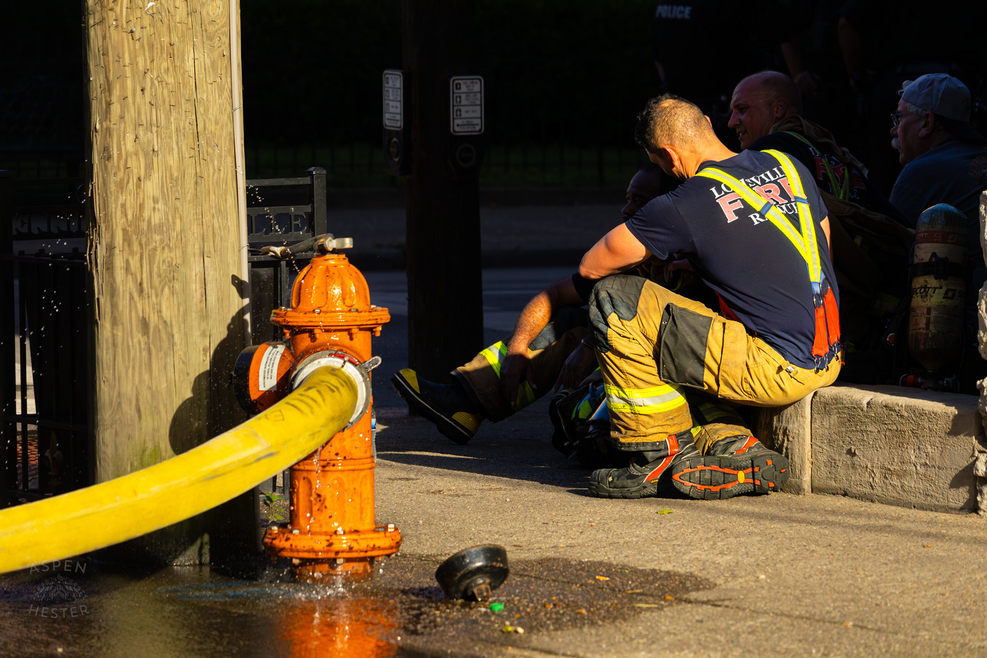Louisville Firefighters Rests After Battling Flames on The Corner of 2nd and Oak Street. June 7th, 2024/Aspen Hester