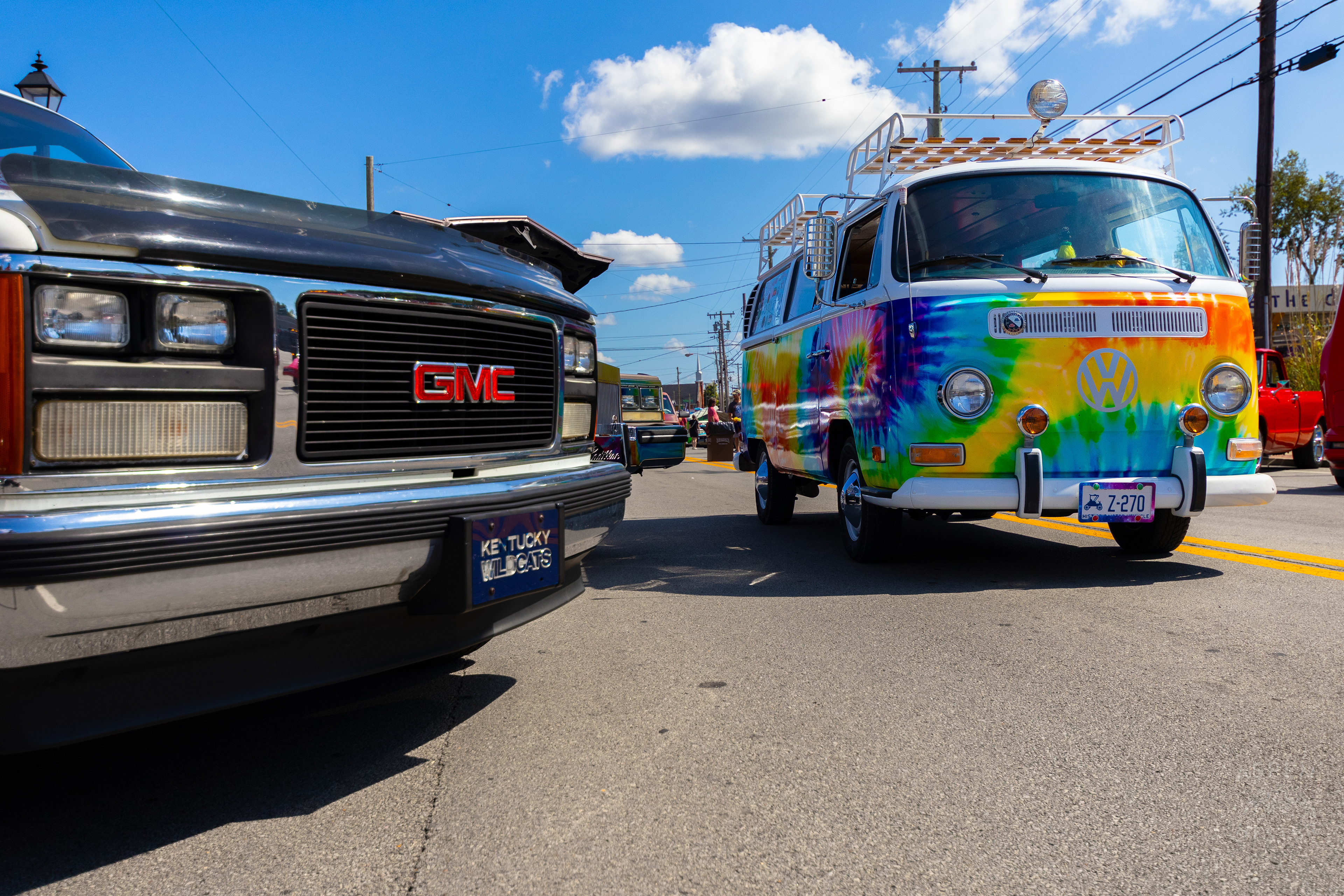 A Rainbow Tie Dye Volkswagen Bus Driving Through The 2024 Jeffersontown Gaslight Festival. September 15th, 2024/Aspen Hester