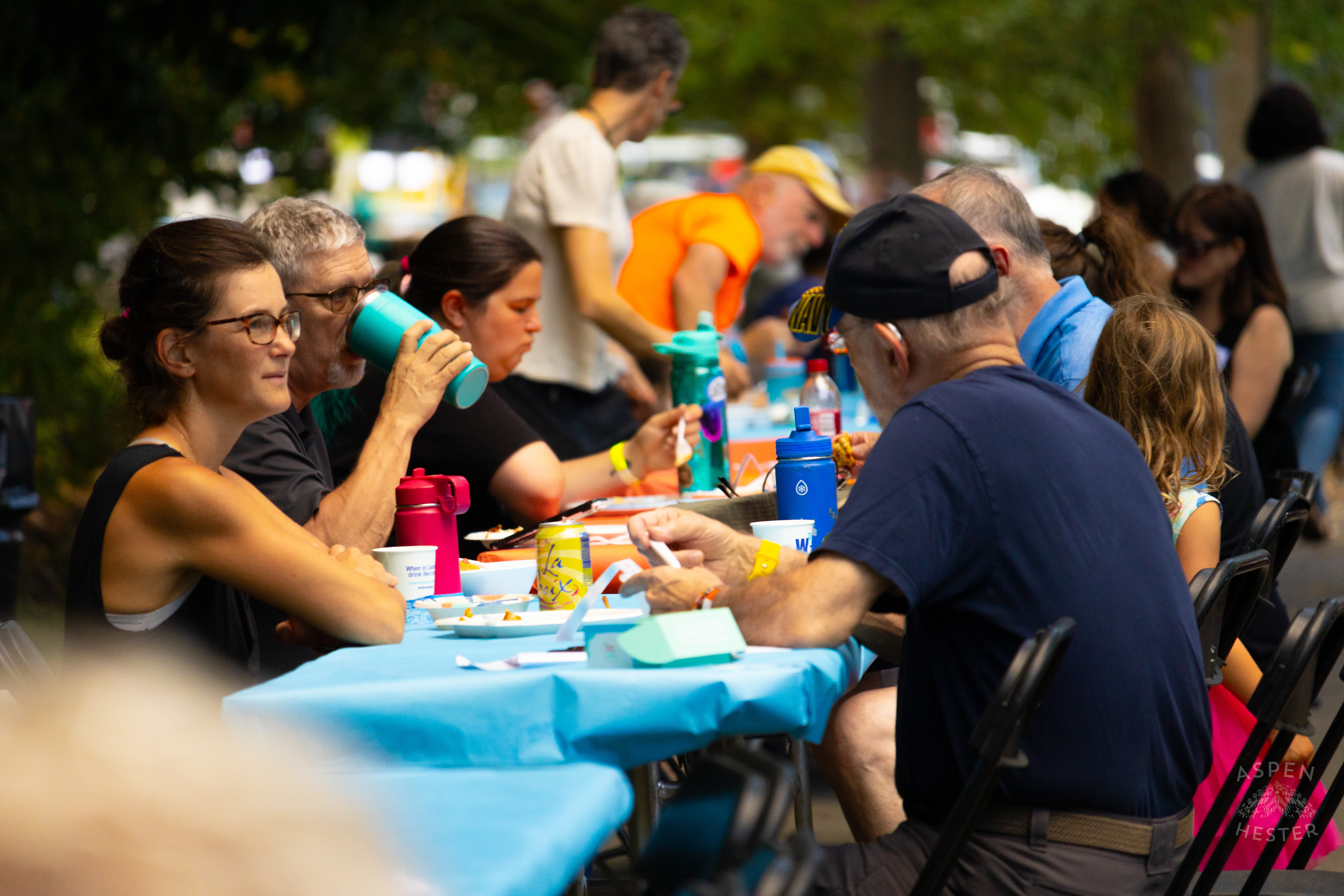 Community Members Eating from The Big Table at Iroquois Park. September 15th, 2024/Aspen Hester