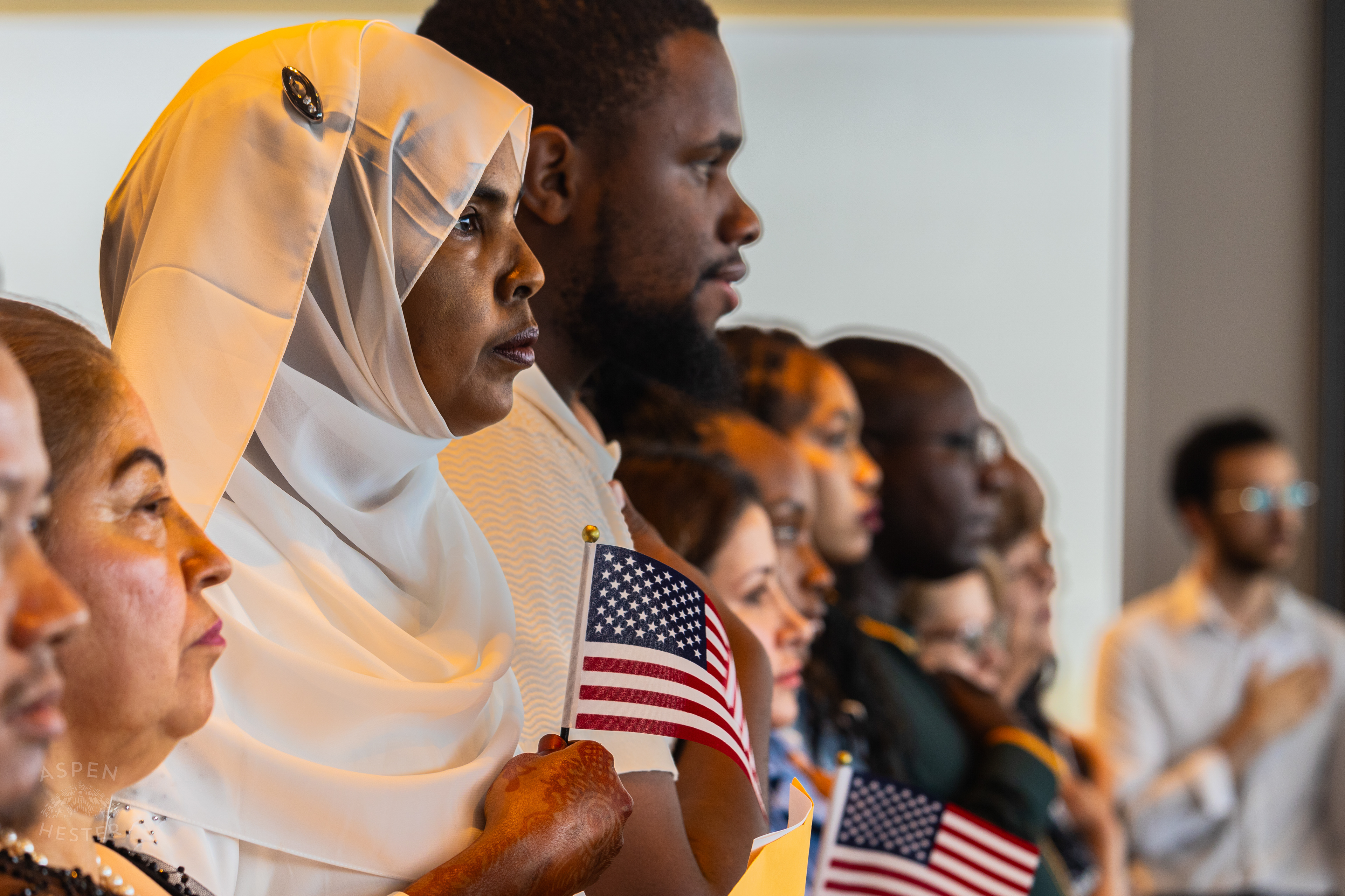 Soon to be American Citizens Standing for The Singing of The Star Spangled Banner During WorldFest's Naturalization Ceremony. August 30th, 2024/Aspen Hester