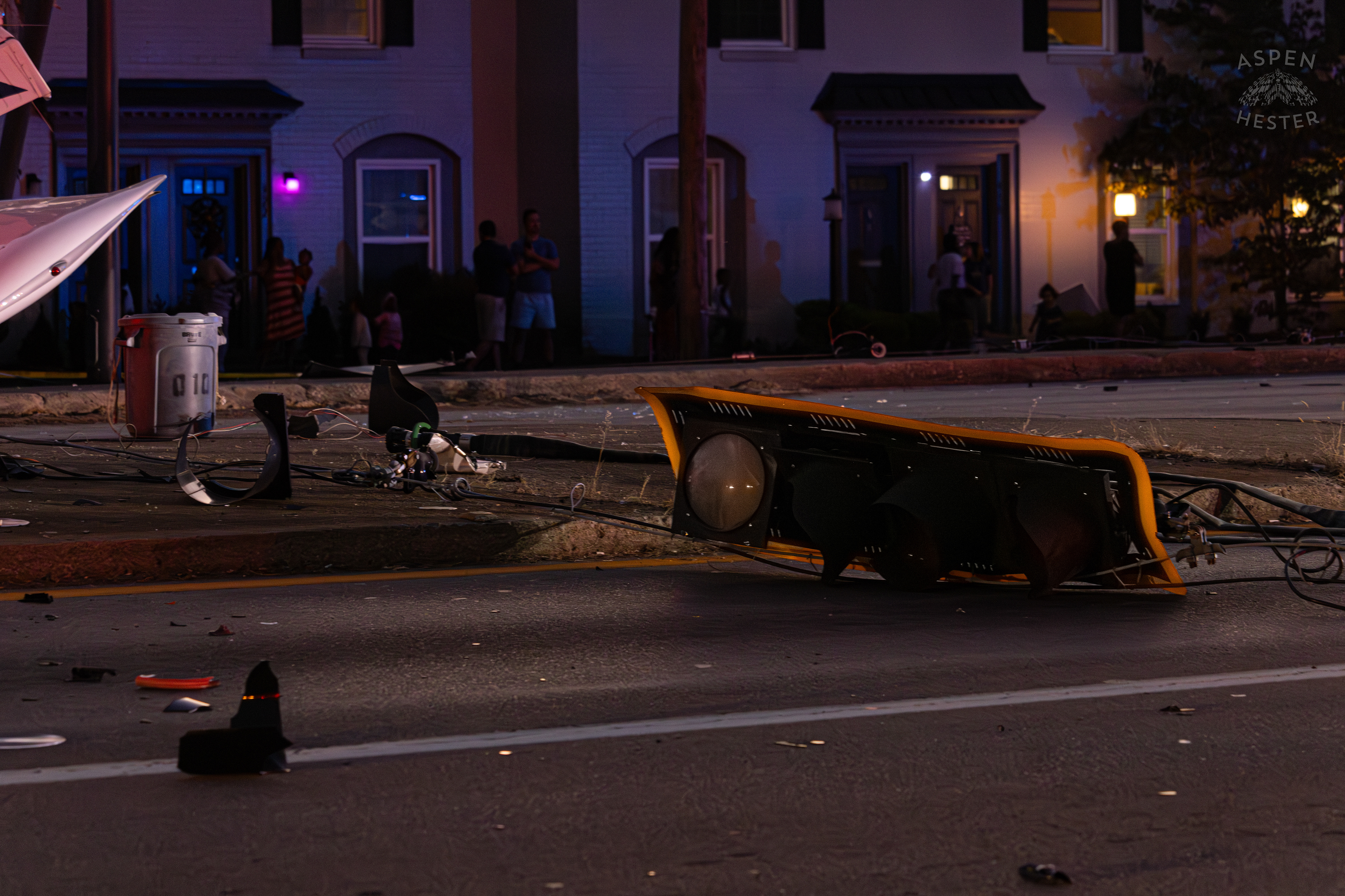 A Stoplight Lays in The Road after A Piper Cherokee Plane Crash Landed, Taking Out Utility Poles, and Hitting A Car on Breckenridge Lane and Kresge Way. October 11th, 2024/Aspen Hester 
