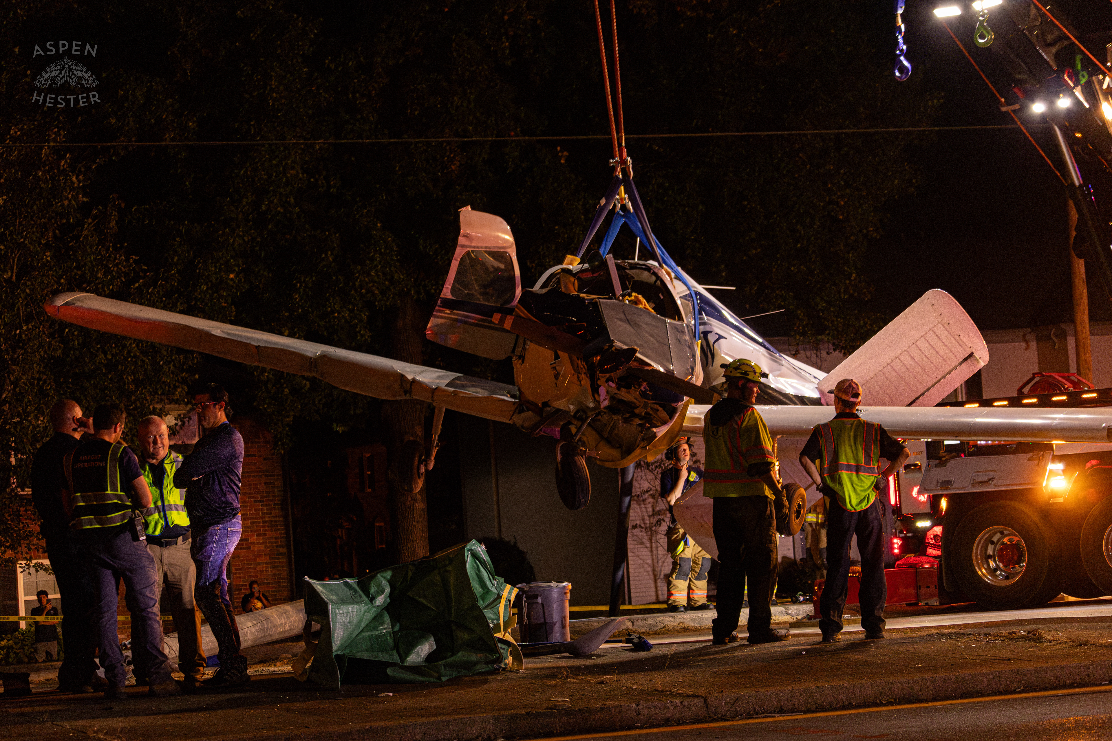 Tony’s Wreckers Crew Working to Remove The Piper Cherokee Plane from the Road after it Crash Landed, Taking Out Utility Poles, and Hitting A Car on Breckenridge Lane and Kresge Way. October 11th, 2024/Aspen Hester 