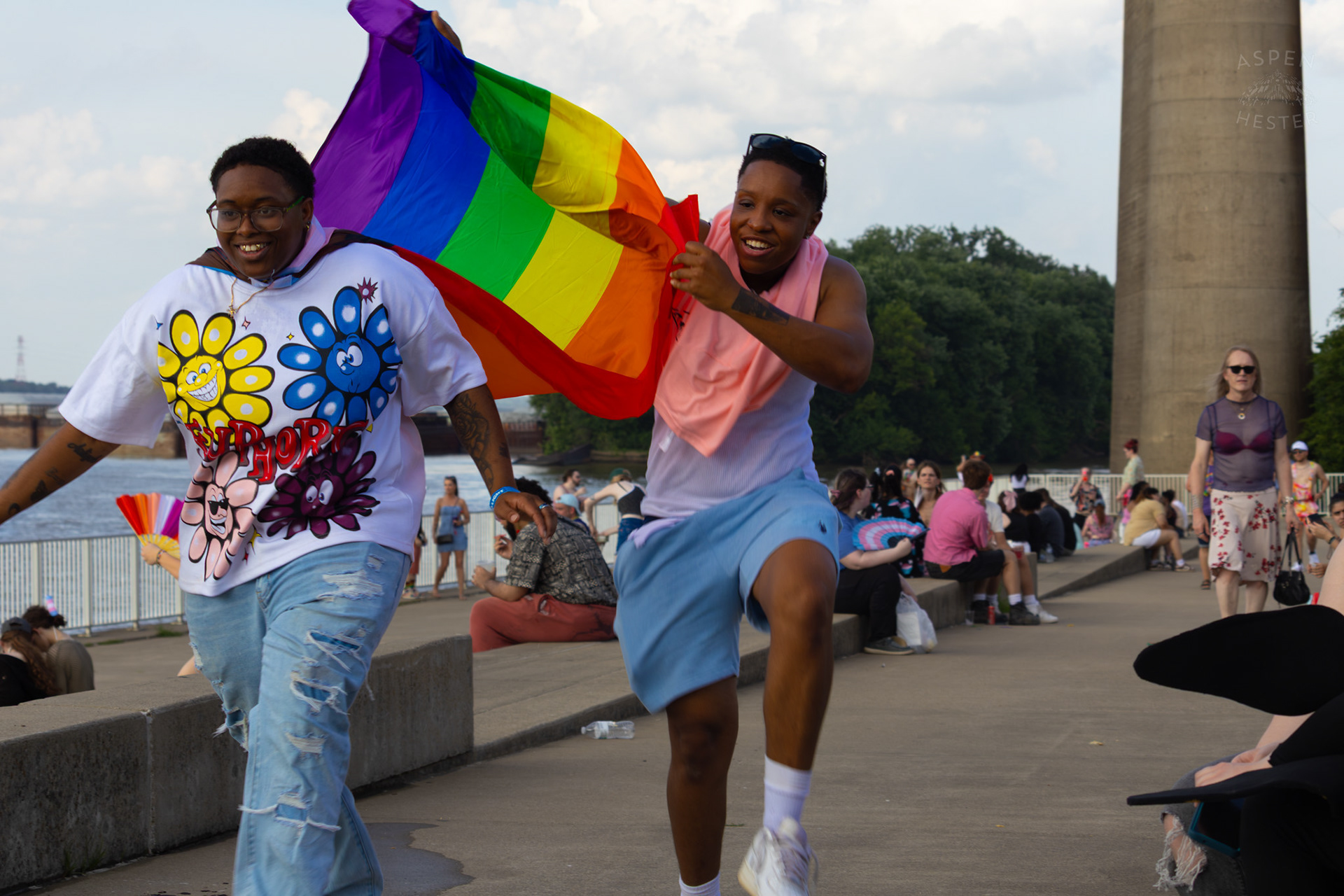 A Prideful Superhero Getting A Little Help To Lift Off The Ground at Kentuckiana Pride 2025. June 21th, 2025/Aspen Hester 