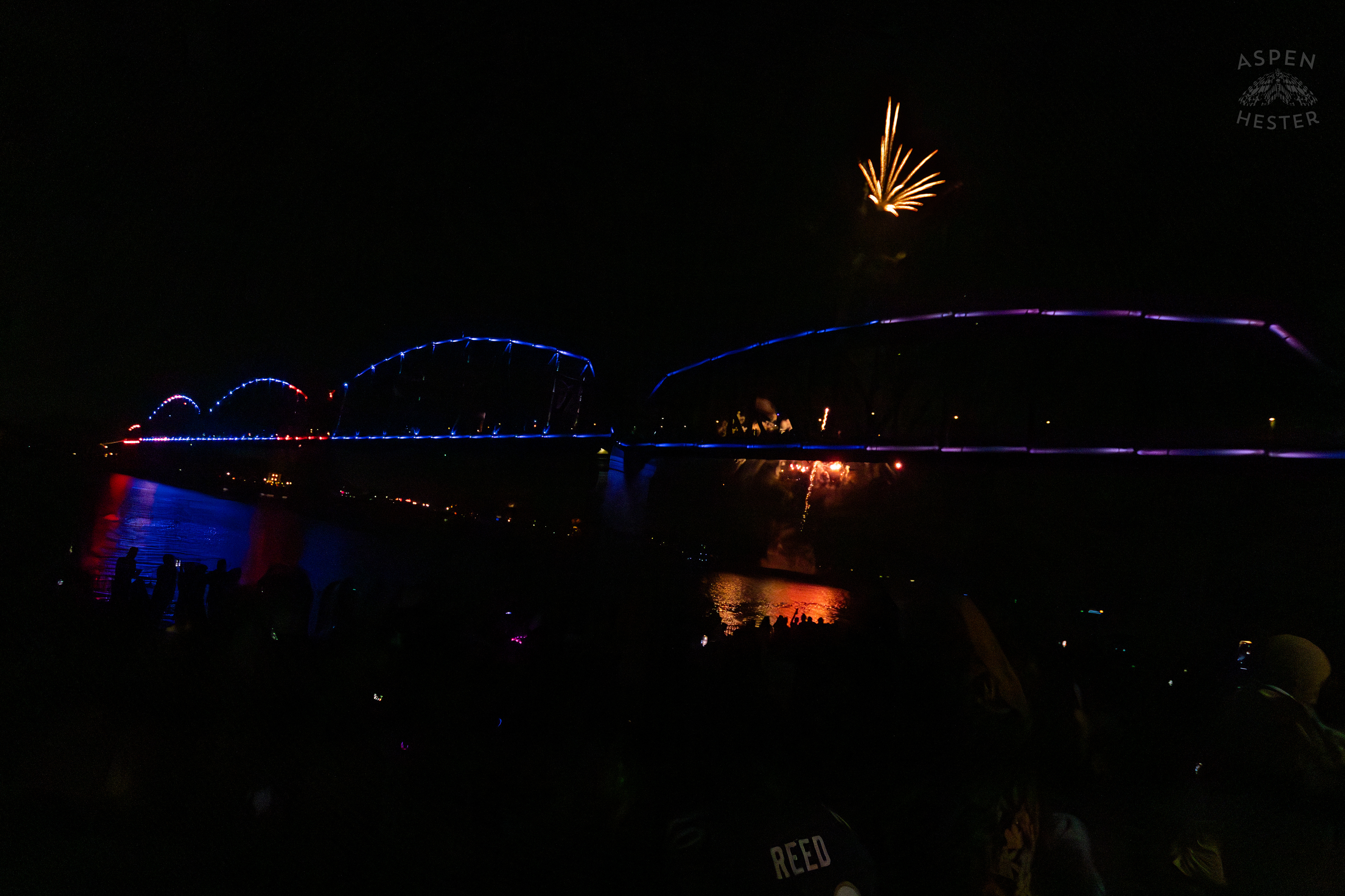 The Big Four Bridge and Attendees During The Fireworks Show at Waterfront Park Fourth of July. July 4th, 2024/Aspen Hester